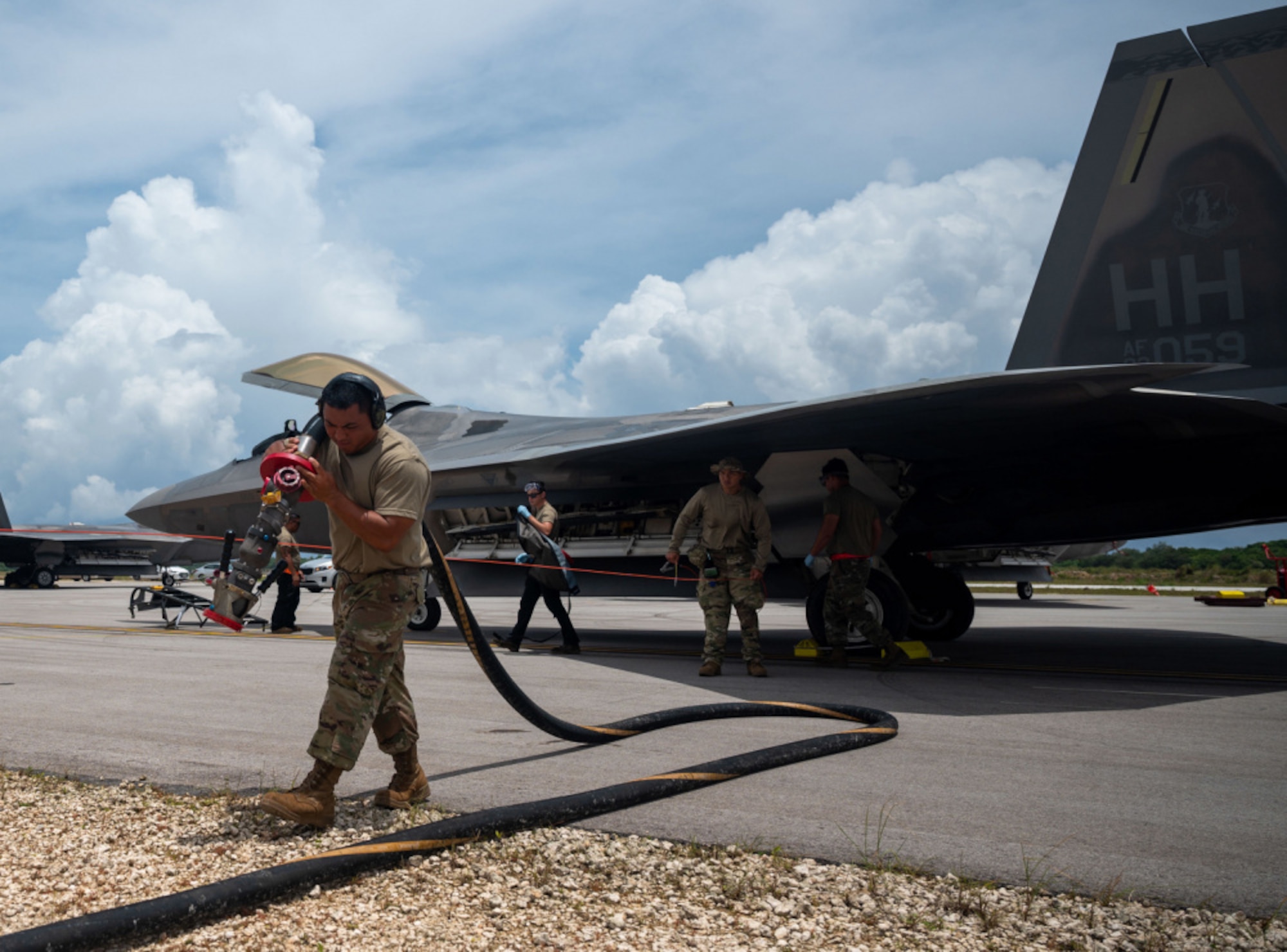 U.S. Air Force crew chiefs assigned to the 154th Aircraft Maintenance Squadron, Air National Guard Hawaii, refuel a F-22 Raptor in support of Architecture Demonstration and Evaluation 5.2 during operation Pacific Iron 21 at Northwest Field, Guam, July 26, 2021. ADE 5.2 is part of the fifth in a series of Architecture Demonstration and Evaluation events conducted by the Department of the Air Force Chief Architect’s Office. (U.S. Air Force photo by Senior Airman Alexandra Minor)