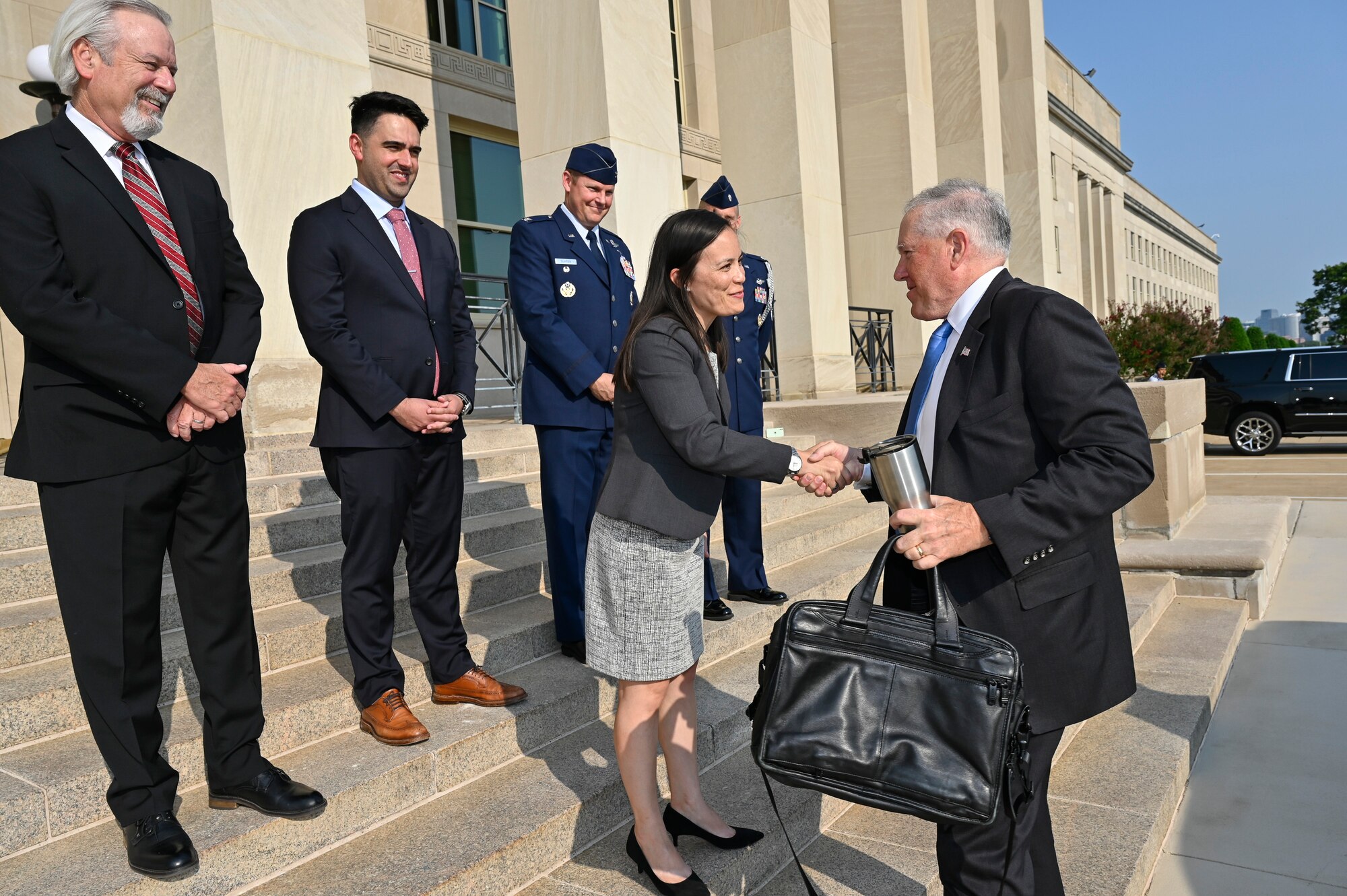 Secretary of the Air Force Frank Kendall shakes hands with Under Secretary of the Air Force Gina Ortiz Jones on arrival for his first day at the Pentagon, Arlington, Va., July 28, 2021. (U.S. Air Force photo by Eric Dietrich)