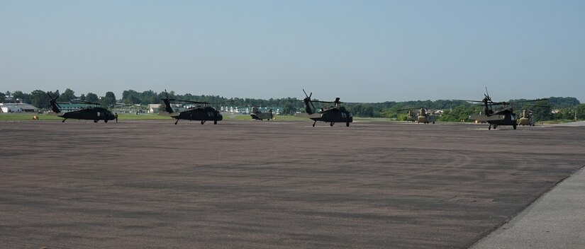 UH-60V Black Hawk helicopters land at the flight line at Fort Indiantown Gap, Pa., on July 27, 2021. The Pennsylvania National Guard’s Eastern Army National Guard Aviation Training Site received the first fielding of UH-60V Black Hawks from the Utility Helicopter Program Office.