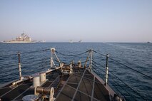 210722-A-UH336-0019 ARABIAN GULF (July 22, 2021) – Guided-missile destroyer USS Mitscher (DDG 57), Royal Navy frigate HMS Montrose (F236), amphibious transport dock ship USS San Antonio (LPD 17), amphibious dock landing ship USS Carter Hall (LSD 50), Coast Guard fast response cutter USCGC Robert Goldman (WPC 1142), Coast Guard patrol boat USCGC Maui (WPB 1304), and patrol coastal ship USS Chinook (PC 9) operate in formation during a multilateral air operations in support of maritime surface warfare (AOMSW) exercise in the Arabian Gulf, July 22. Commander, Task Force 55 operates in the U.S. 5th Fleet area of operations in support of naval operations to ensure maritime stability and security in the Central Region, connecting the Mediterranean and Pacific through the western Indian Ocean and three critical chokepoints to the free flow of global commerce. (U.S. Army photo by Spc. Joseph DeLuco)