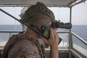 210722-A-UH336-0088 ARABIAN GULF (July 22, 2021) – Marine Cpl. Robert Van Pelt, observes targets aboard patrol coastal ship USS Tempest (PC 2) during a multilateral air operations in support of maritime surface warfare (AOMSW) exercise in the Arabian Gulf, July 22. Commander, Task Force 55 operates in the U.S. 5th Fleet area of operations in support of naval operations to ensure maritime stability and security in the Central Region, connecting the Mediterranean and Pacific through the western Indian Ocean and three critical chokepoints to the free flow of global commerce. (U.S. Army photo by Spc. Joseph DeLuco)