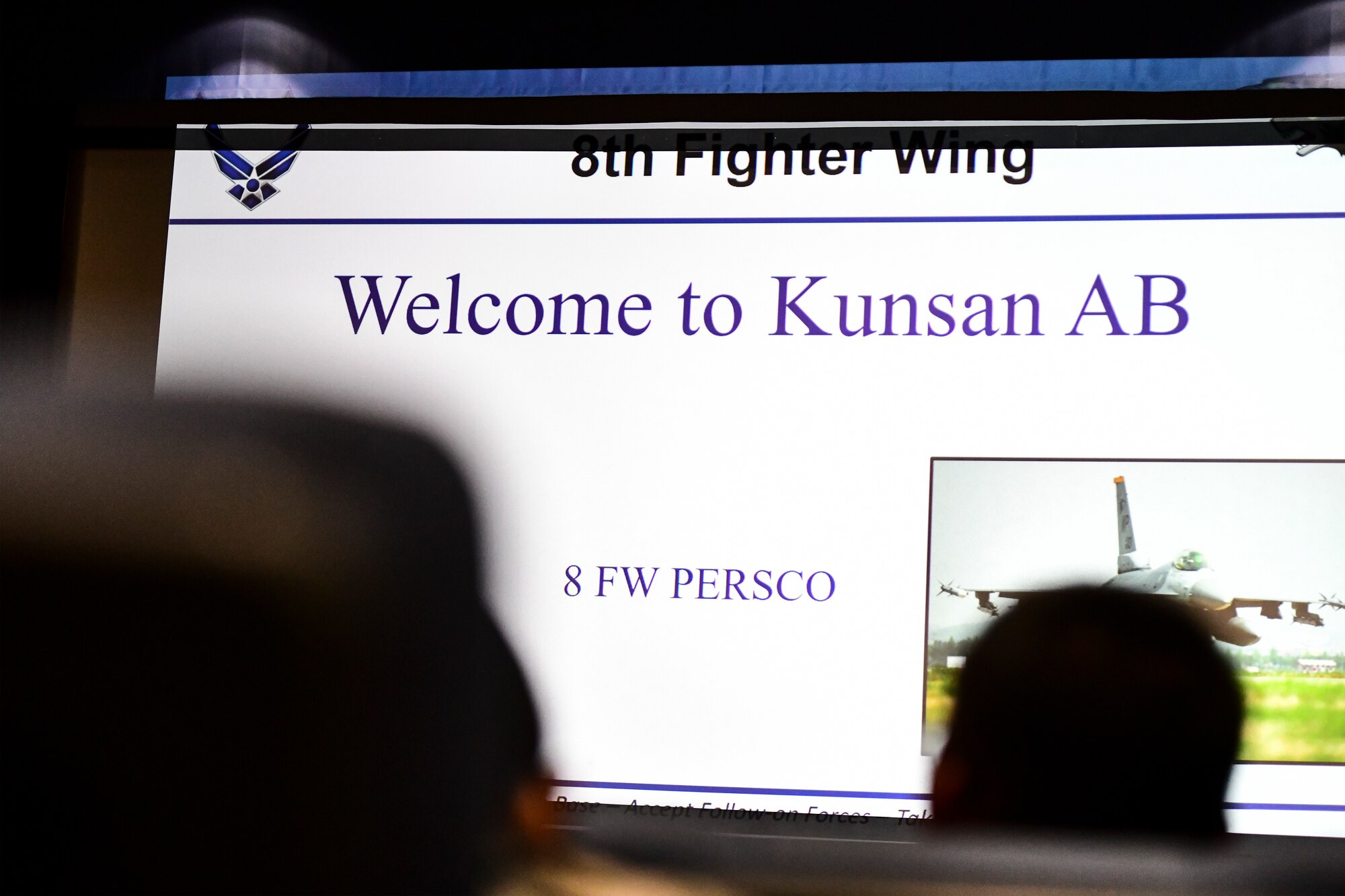 Airmen attend a briefing