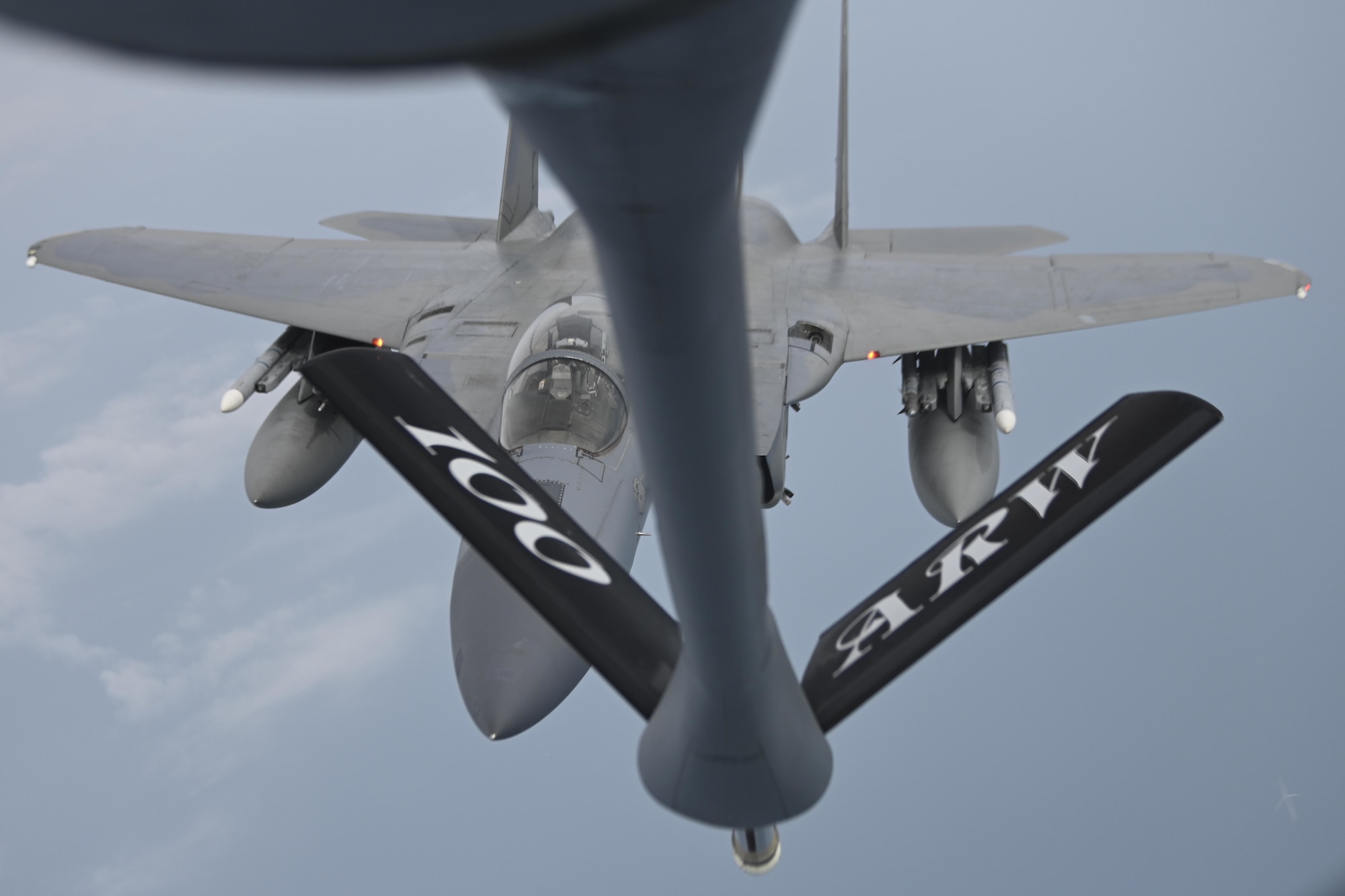 A U.S. Air Force F-15C Eagle aircraft assigned to the 48th Fighter Wing at Royal Air Force Lakenheath, England, approaches a KC-135 Stratotanker aircraft assigned to the 100th Air Refueling Wing at RAF Mildenhall, England, for refueling over the North Sea, July 27, 2021. The 100th ARW is the only permanent air refueling wing in Europe and Africa. (U.S. Air Force photo by Senior Airman Joseph Barron)