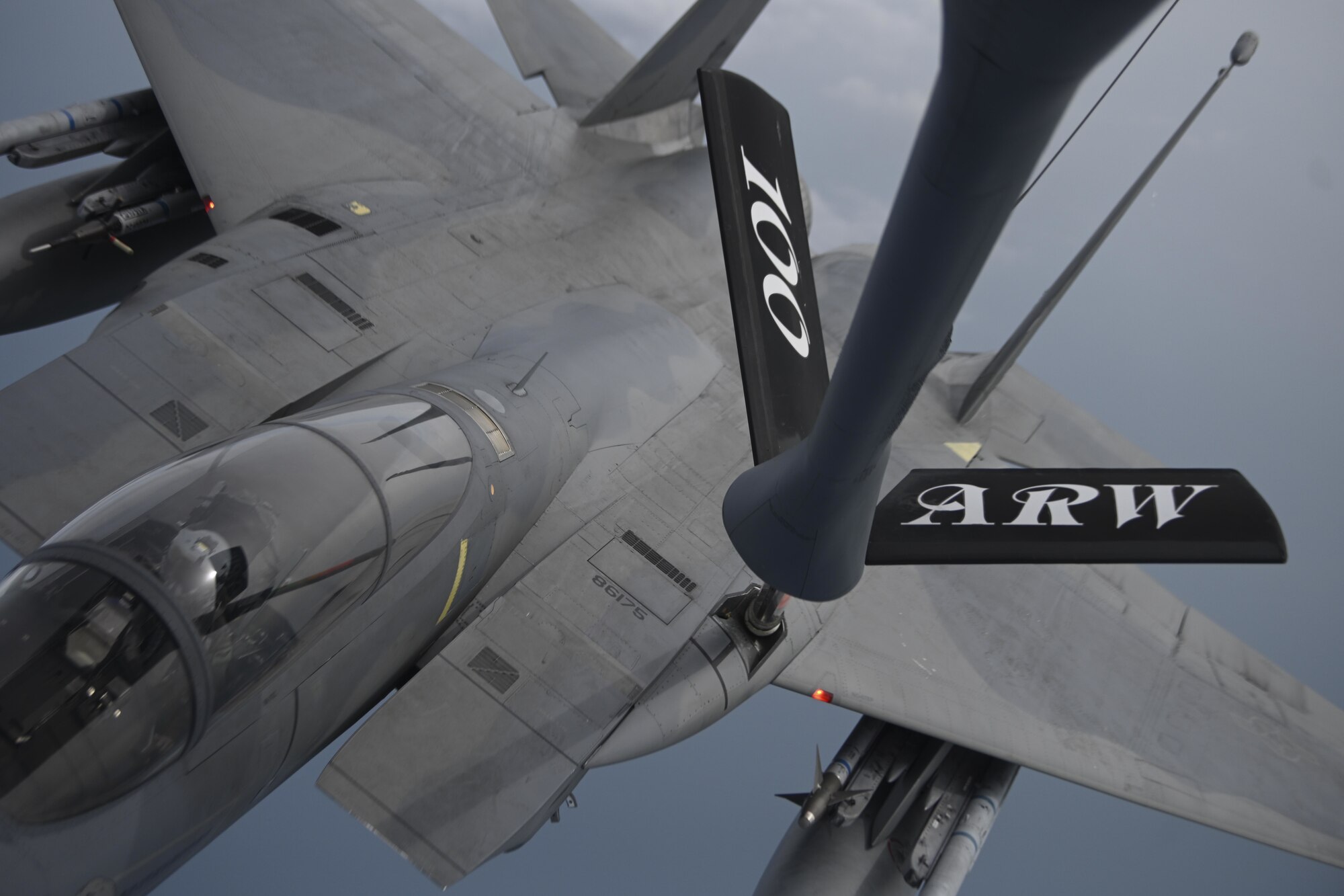 A U.S. Air Force F-15C Eagle aircraft assigned to the 48th Fighter Wing at Royal Air Force Lakenheath, England, receives fuel from a KC-135 Stratotanker aircraft assigned to the 100th Air Refueling Wing at RAF Mildenhall, England, over the North Sea, July 27, 2021. The KC-135 Stratotanker extends the range of fighter, bomber and transport aircraft. (U.S. Air Force photo by Senior Airman Joseph Barron)