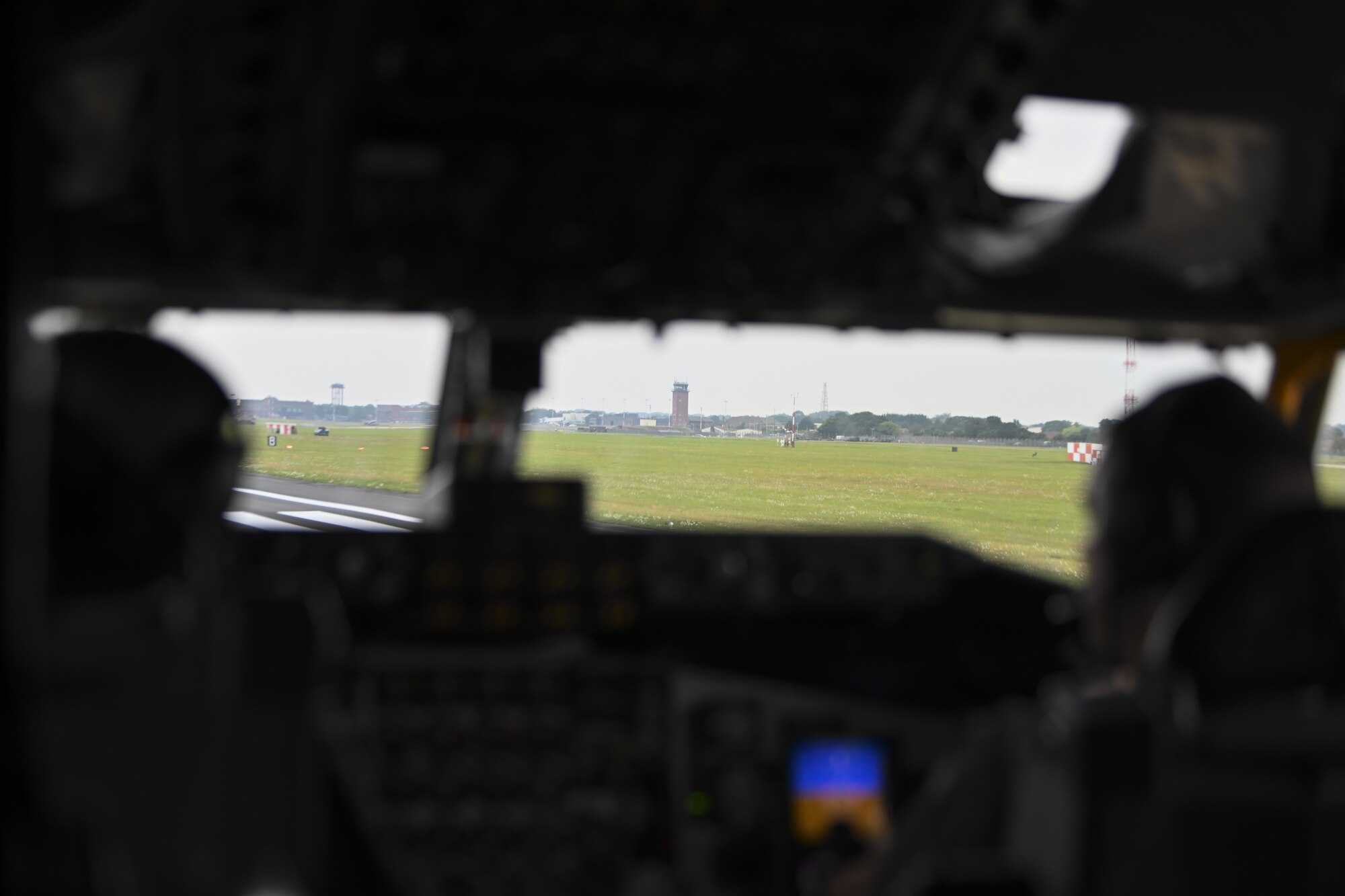 U.S. Air Force Capt. William Carroll, 351st Air Refueling Squadron pilot, left, and 1st Lt. Austin Haney, 351st ARS pilot, wait on the runway before takeoff in a KC-135 Stratotanker aircraft at Royal Air Force Mildenhall, England, July 27, 2021. The 100th Air Refueling Wing provides air refueling support throughout the European and African areas of responsibility. (U.S. Air Force photo by Senior Airman Joseph Barron)