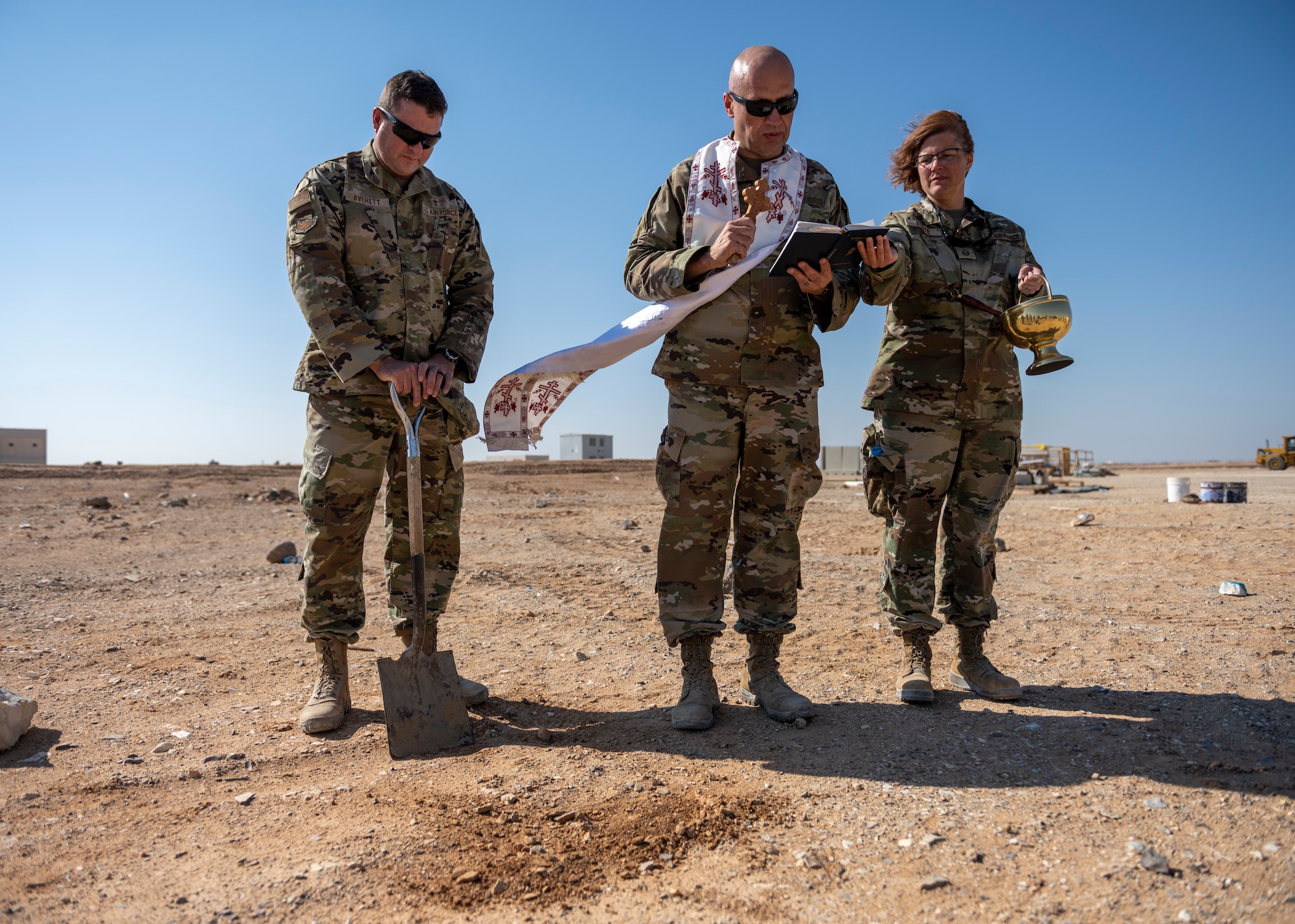 U.S. Air Force chaplains and religious affairs Airman stand at ground breaking site