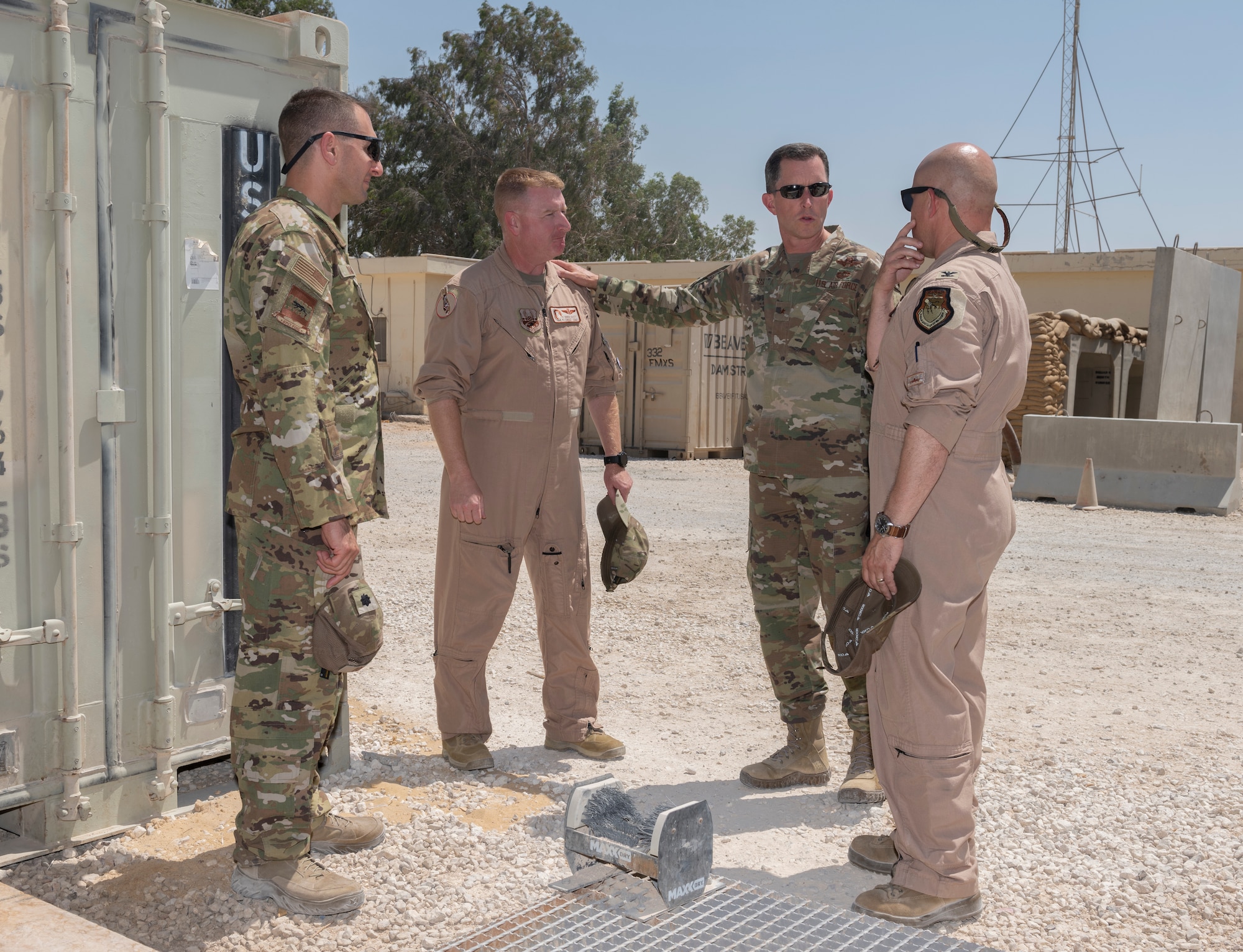 U.S. Air Force Brig. Gen. Christopher Sage, center right, 332nd Air Expeditionary Wing commander, speaks with 332nd Expeditionary Operations Group leadership during an immersion July 23, 2021, in an undisclosed location somewhere in Southwest Asia. The immersions provide 332nd AEW leadership an opportunity to interact with Airmen and receive a detailed view of unit capabilities. (U.S. Air Force photo by Senior Airman Cameron Otte)