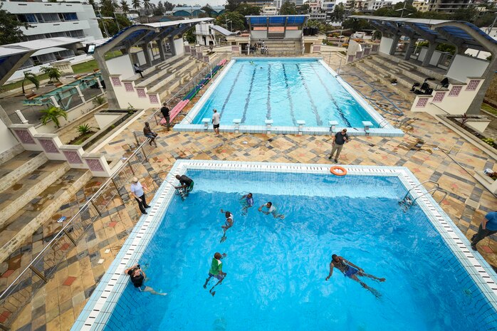 (July 28, 2021) Mozambique Sailors conduct water survival training during exercise Cutlass Express 2021 at the Bandari Maritime Academy in Mombasa, Kenya, July 28, 2021. Cutlass Express is designed to improve regional cooperation, maritime domain awareness and information sharing practices to increase capabilities between the U.S., East African and Western Indian Ocean nations to counter illicit maritime activity.