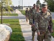 Chief Master Sgt. Terry McGonnell and fellow members of the 127th Security Forces Squadron, Selfridge Air National Guard Base, Michigan, arrive at Alpena Combat Readiness Training Center here on July 27, 2021. The defenders arrived to participate in Exercise Spartan, a two weeks long exercise meant to demonstrate the unit’s capability to operate in a contested, degraded and operationally-limited environment, against a near-peer adversary.