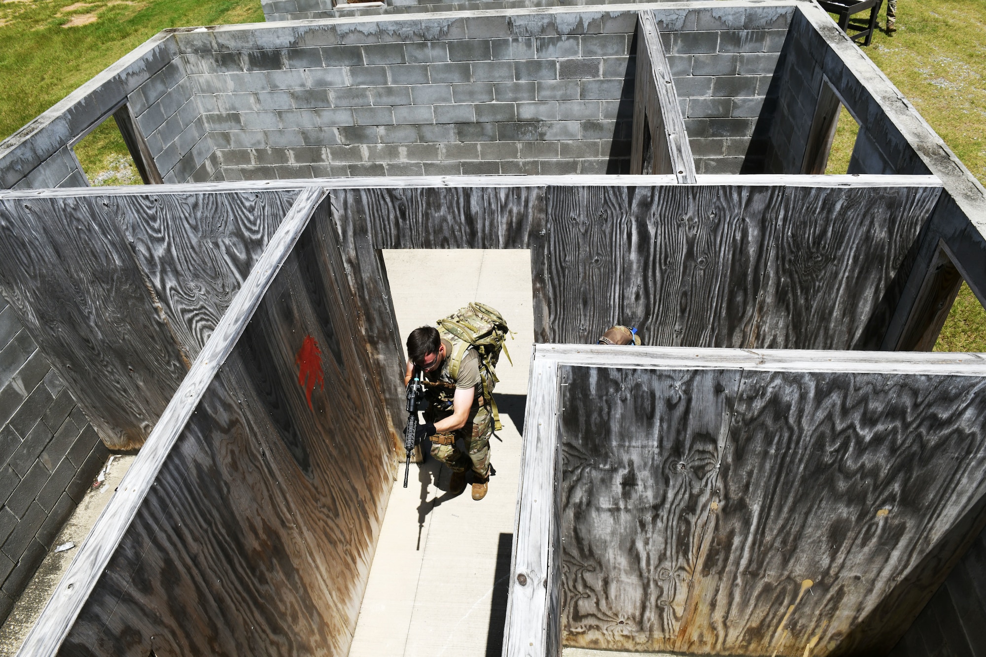 Military member going through a building