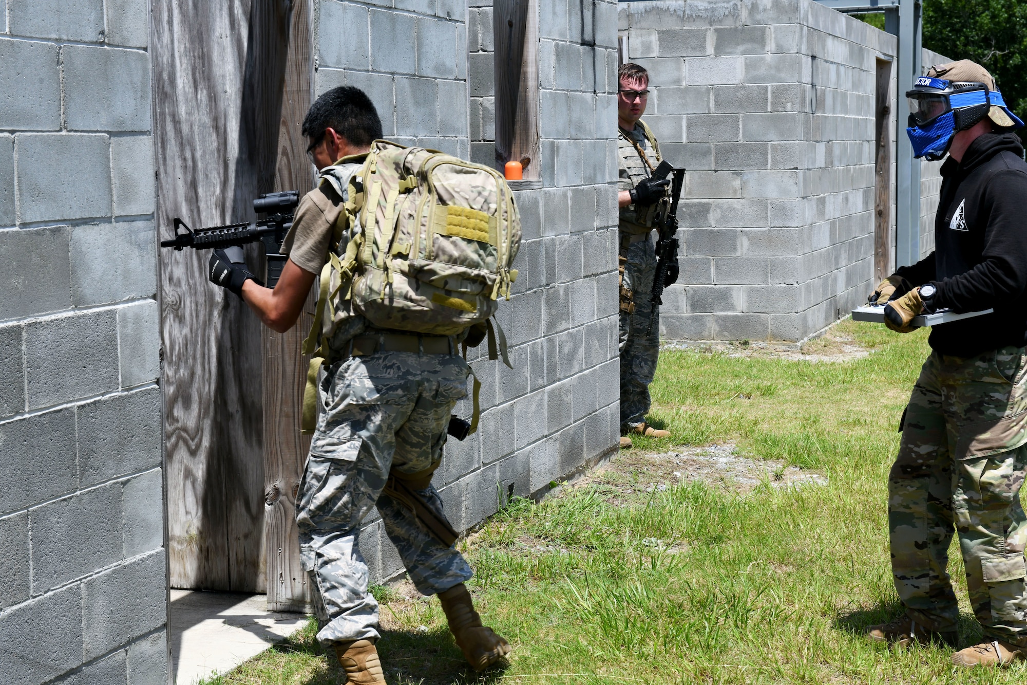 Military member going into building