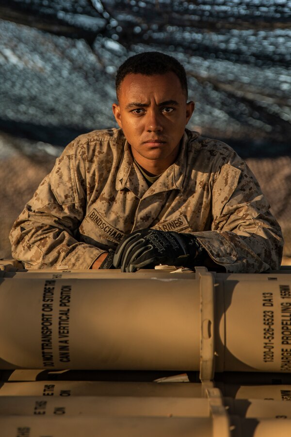 Lance Cpl. Samuel Bindschadler, a field artillery operator with 5th Battalion, 14th Marines, 4th Marine Division, prepares to unload ammunition during Integrated Training Excercise (ITX) 4-21 at Marine Corps Air Ground Combat Center, Twentynine Palms, California on July 27, 2021. Reserve Marines and Sailors have come together from across the country as an integrated Marine Air-Ground Task Force to take part in a live-fire, combined arms exercise that will better prepare Marine Forces Reserve in its mission to augment and reinforce the Active Component.  (U.S. Marine Corps photo by Lance Cpl. Samwel Tabancay)