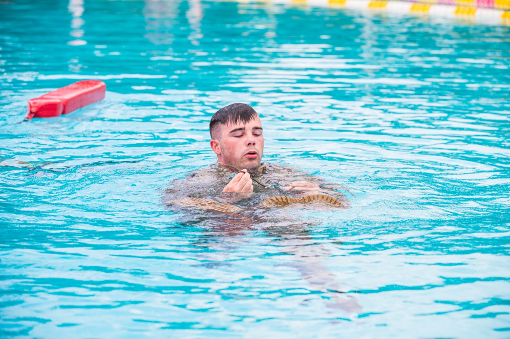 Army Staff Sgt. Edward Nelan competes in the water survival portion of the 2021 U.S. Army Medical Command Best Leader Competition