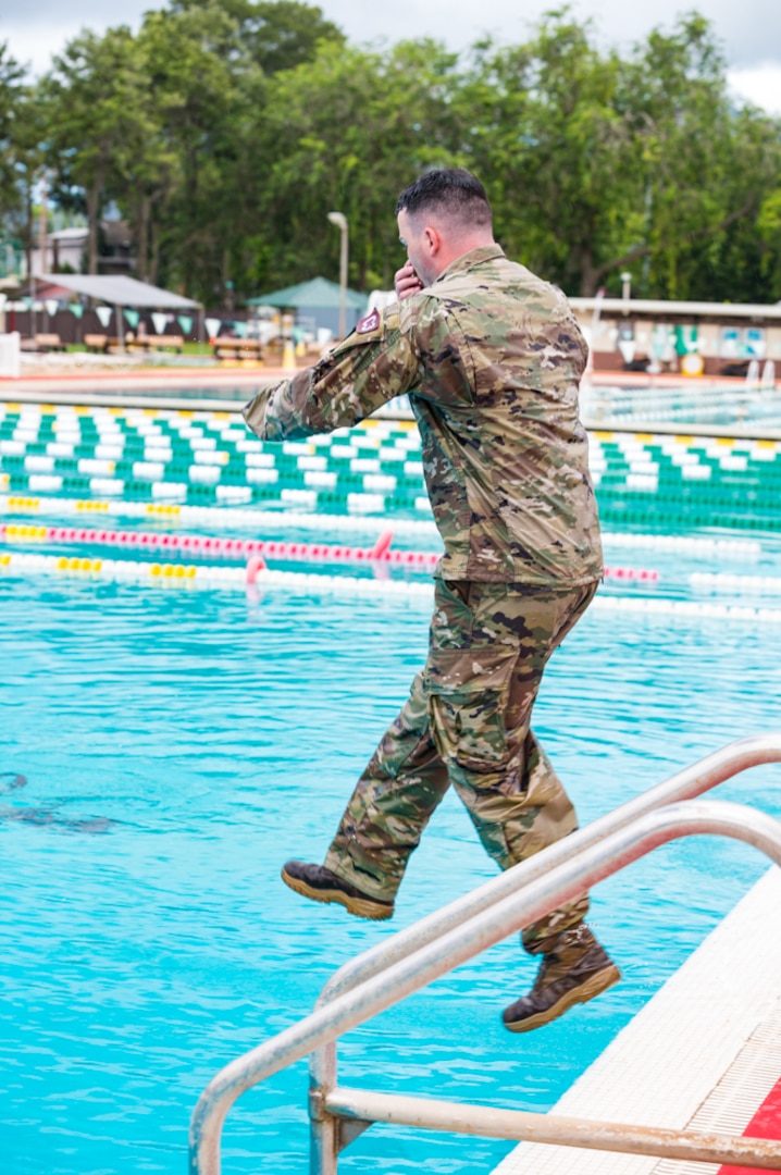 Army Staff Sgt. Edward Nelan competes in the water survival portion
