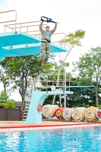 Army Staff Sgt. Edward Nelan competes in the water survival portion