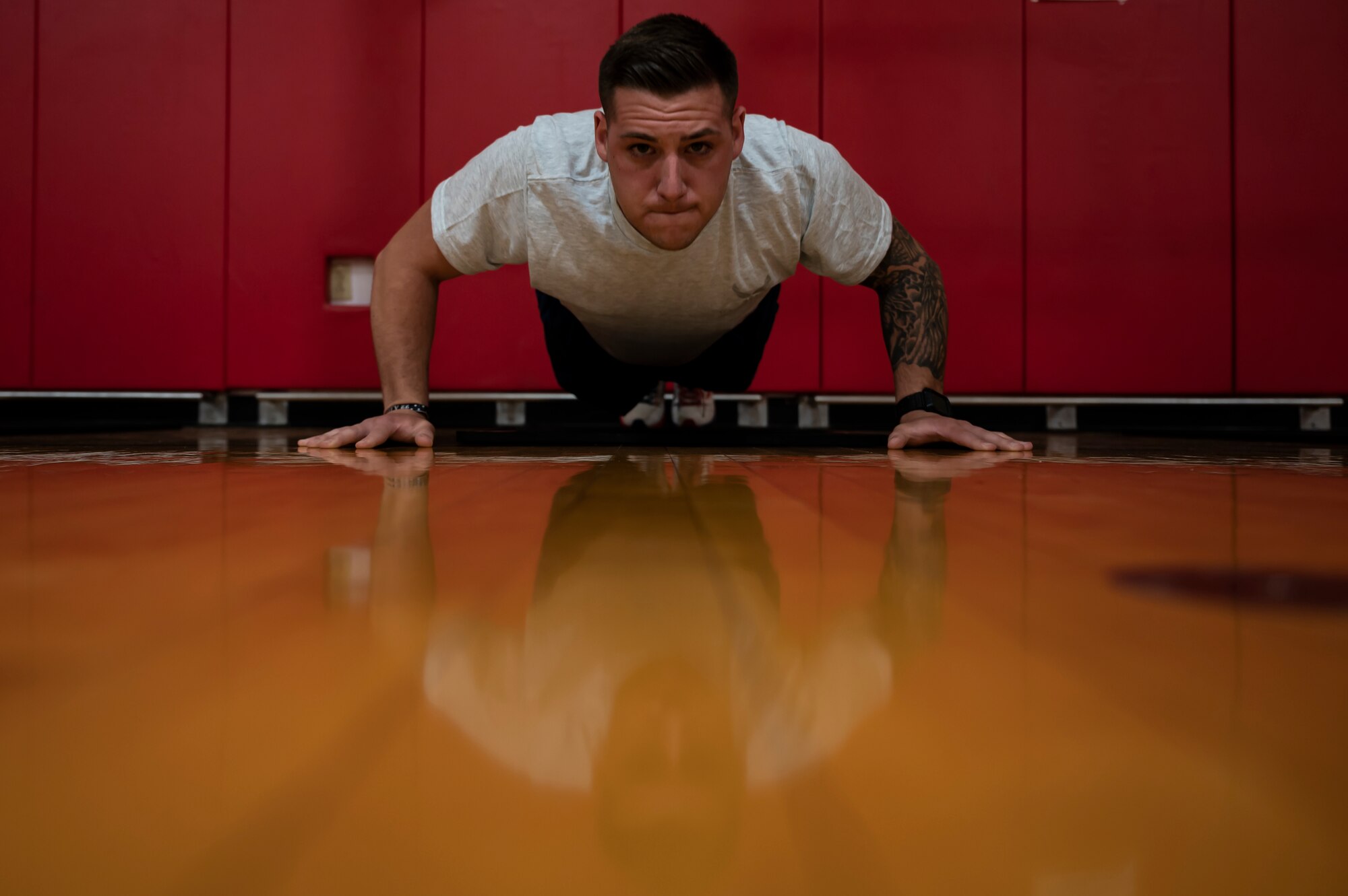 Senior Airman Jimmy Larkin, 911th Security Forces Squadron patrolman, performs a push-up during a physical fitness test at the Pittsburgh International Airport Air Reserve Station, Pennsylvania, July 29, 2021. The U.S. Air Force started conducting fitness tests in July after a brief hiatus due to COVID-19.