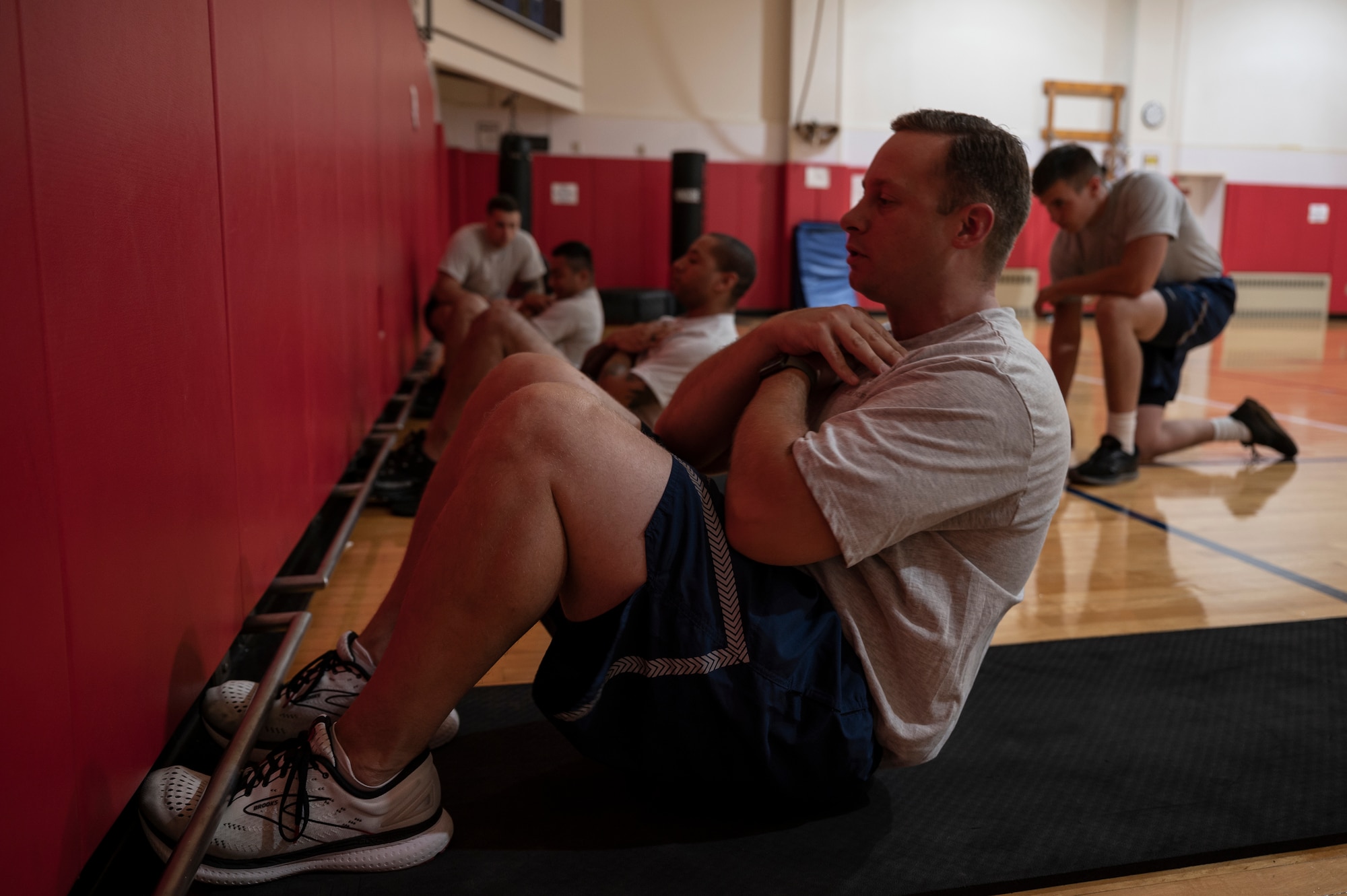 Master Sgt. Joseph Bridge, 911th Airlift Wing finance technician, performs a sit-up as during a physical fitness test at the Pittsburgh International Airport Air Reserve Station, Pennsylvania, July 29, 2021. The U.S. Air Force started conducting physical fitness tests with some changes to the standards after a brief hiatus due to COVID-19.