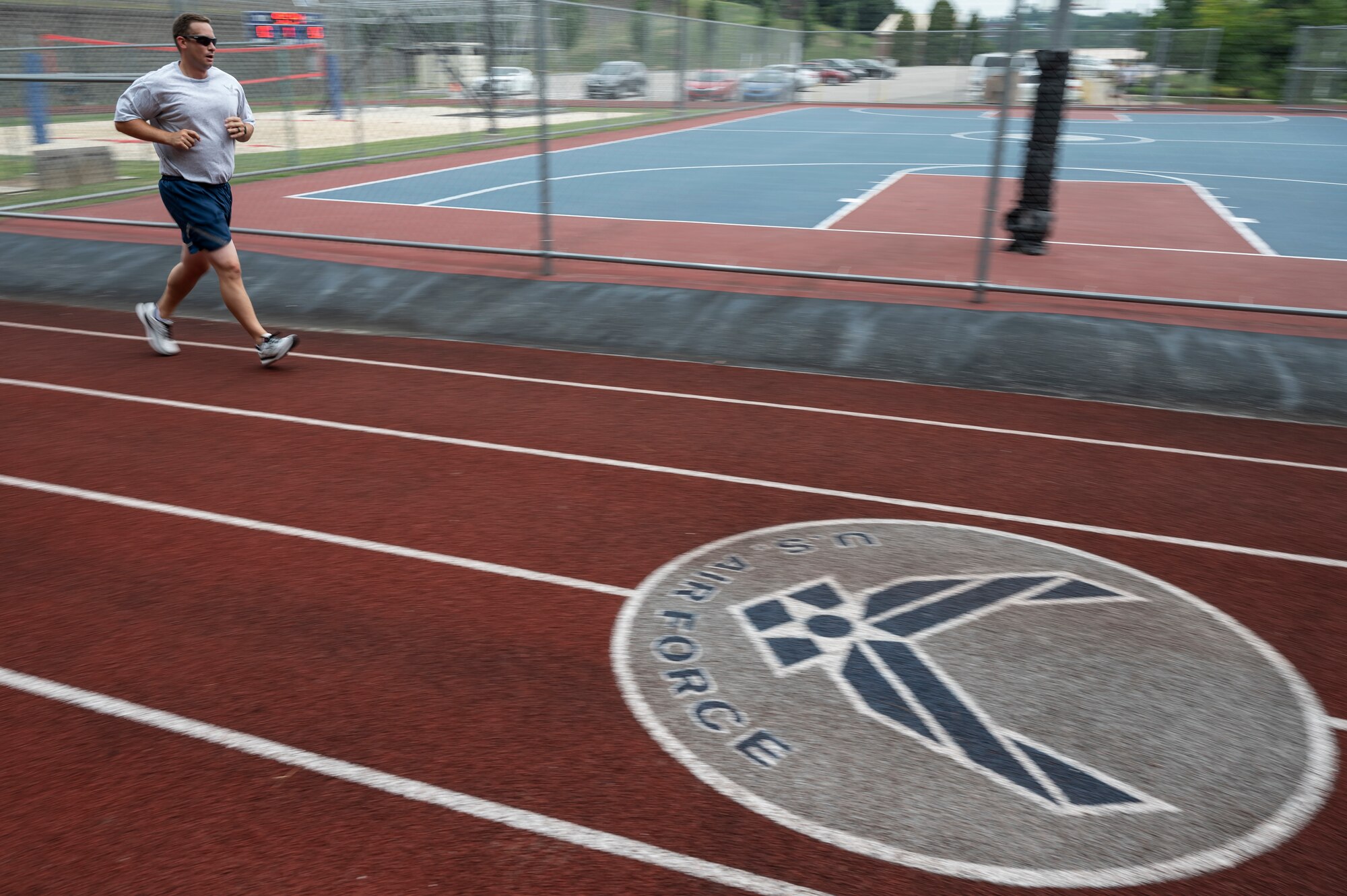 Master Sgt. Joseph Bridge, 911th Airlift Wing finance technician, runs on the track during a physical fitness test at the Pittsburgh International Airport Air Reserve Station, Pennsylvania, July 29, 2021. The U.S. Air Force started conducting physical fitness tests with some changes to the standards after a brief hiatus due to COVID-19.