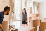 Lt. Col. David Chapman’s expectant wife, Jaime, oversees movers as they pack their household goods May 20, 2020.