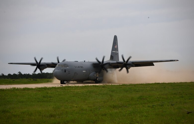 U.S. Airmen from the 19th Airlfit Wing, Little Rock Air Force Base, Arkansas, land a C-130J Super Hercules