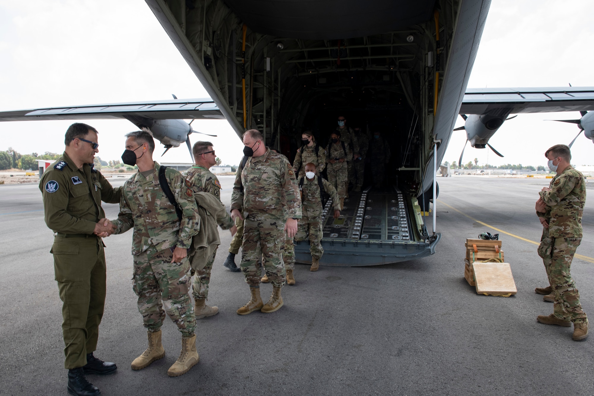 U.S. Air Force Lt. Gen. Steven Basham, U.S. Air Forces in Europe and Air Forces Africa deputy commander and Joint Task Force-Israel commander, and other U.S. Air Force members are greeted by Israel Defense Forces Col. Gershon Zlotnik, Israeli Task Force deputy commander, upon arrival in Israel to participate in Juniper Falcon 21-2, July 23, 2021. Despite the challenges presented by COVID-19, both the U.S. and Israel are focused on building readiness in support of the United States’ ironclad commitment to assist in the defense of Israel, and are committed to the safety of our personnel, their families and the communities where activities are taking place.