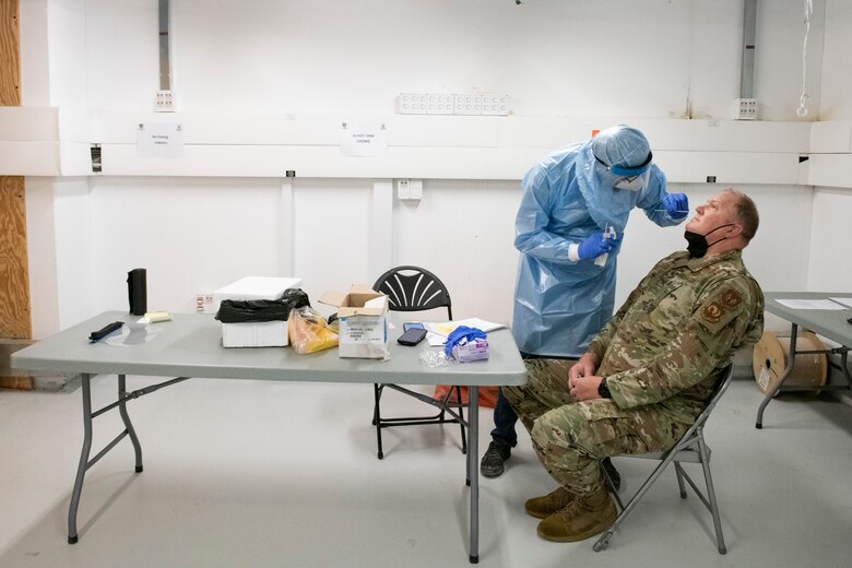 U.S. Air Force Col. Peter Olsen, U.S. Forces in Europe and Air Forces Africa readiness and integration division chief, receives a COVID-19 test upon arrival in Israel to participate in Juniper Falcon 21-2, July 23, 2021. In accordance with host nation guidance, newly arriving personnel were required to wear facial masks, receive COVID-19 tests and proceed to isolation.