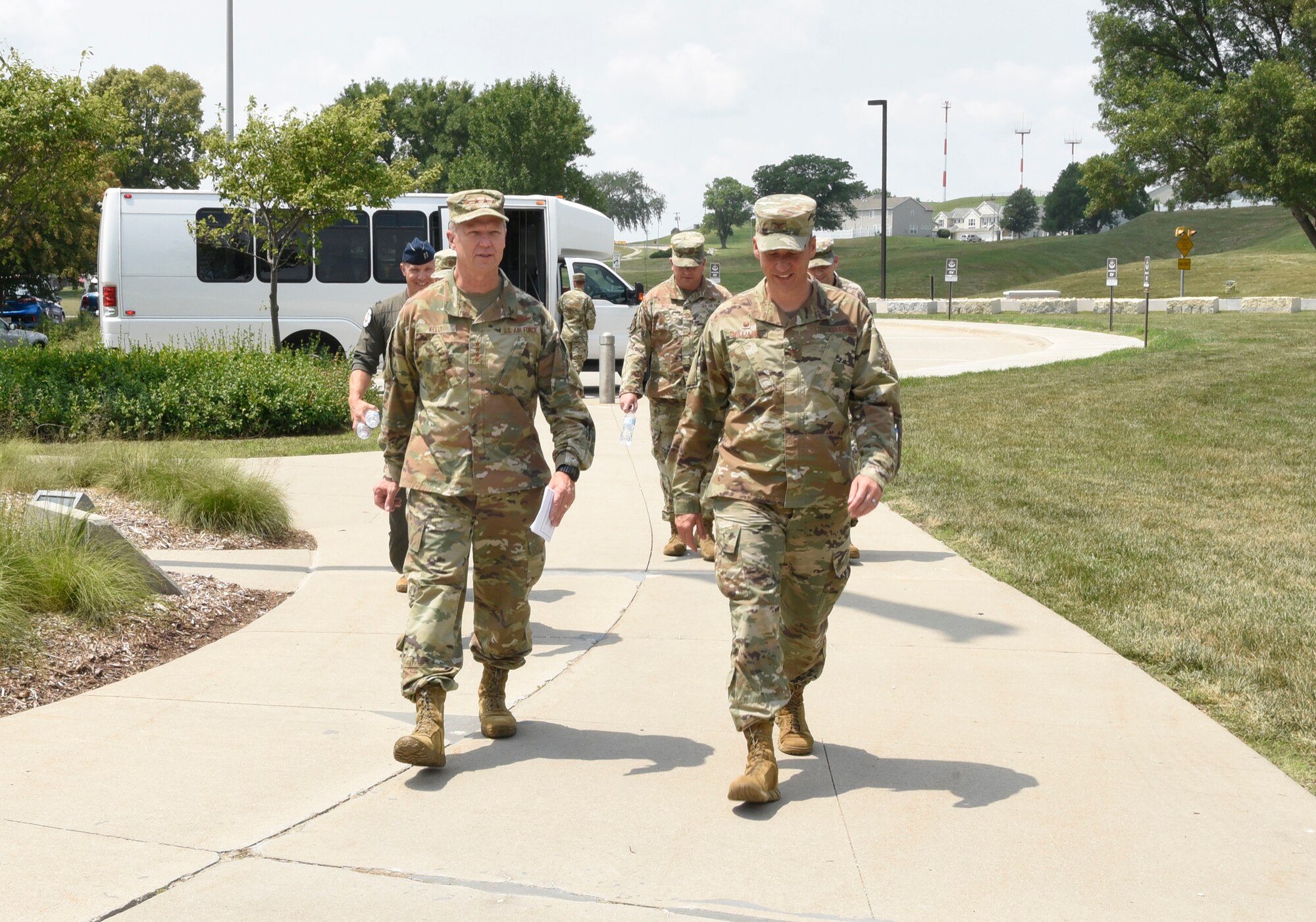 Gen. Mark Kelly, commander of Air Combat Command, walks alongside Col. Patrick Williams, 557th Weather Wing commander, as they approach the 557th WW headquarters building at Offutt Air Force Base, Nebraska on July 21, 2021.