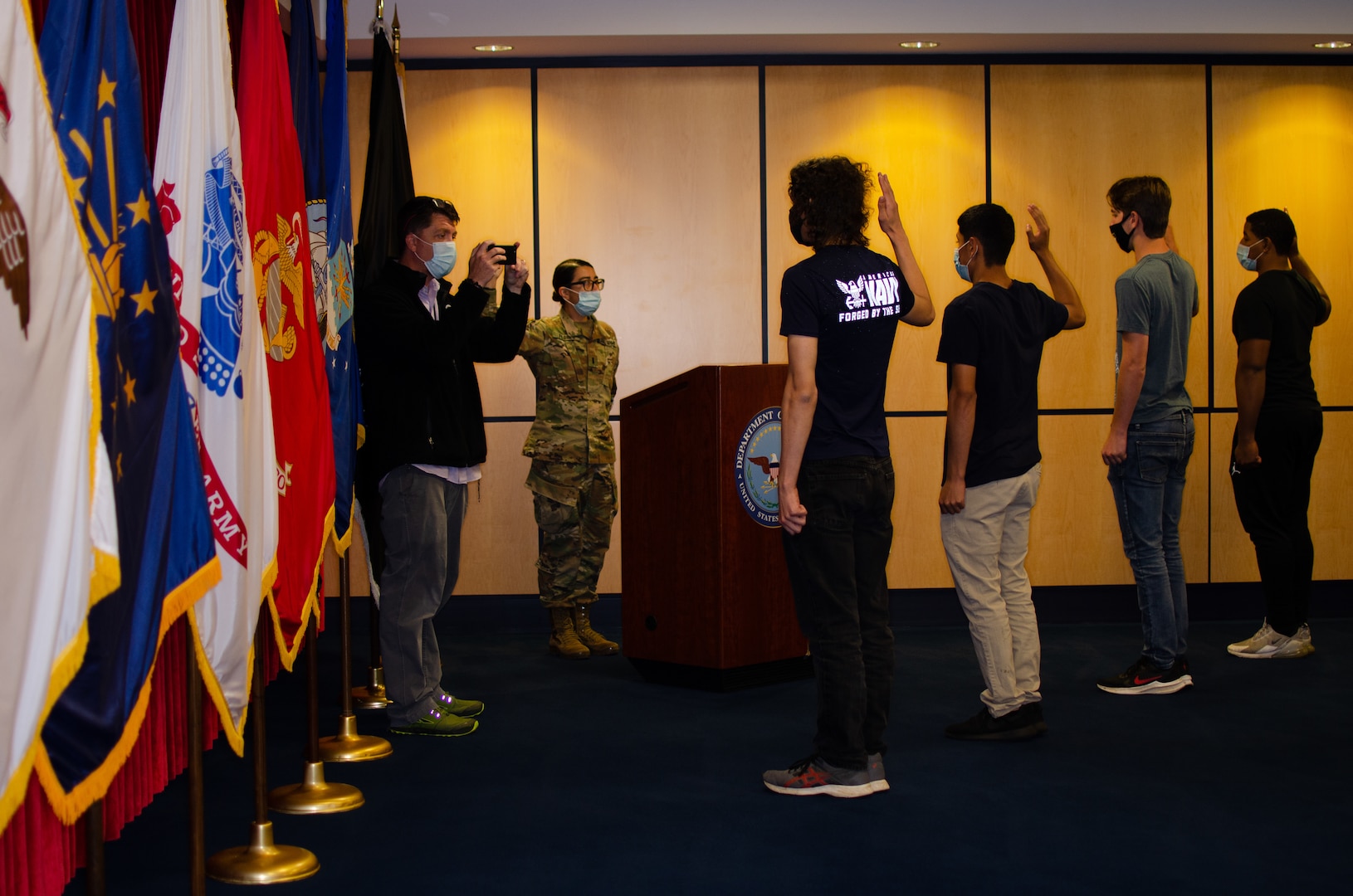 Applicants take the oath of enlistment at Chicago MEPS July 14.