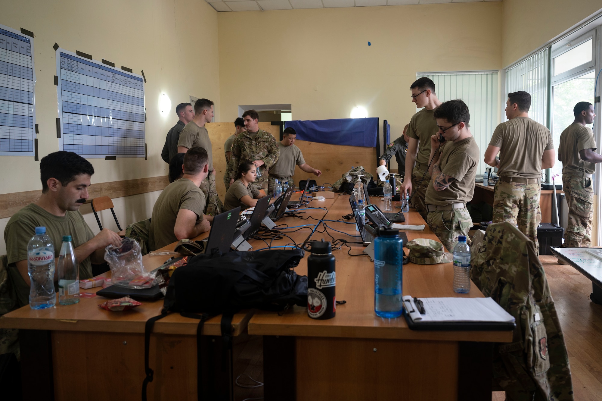 U.S. Air Force Airmen assigned to Ramstein Air Base, Germany, construct flight and mission plans in a command center in preparation for exercise Agile Spirit 21