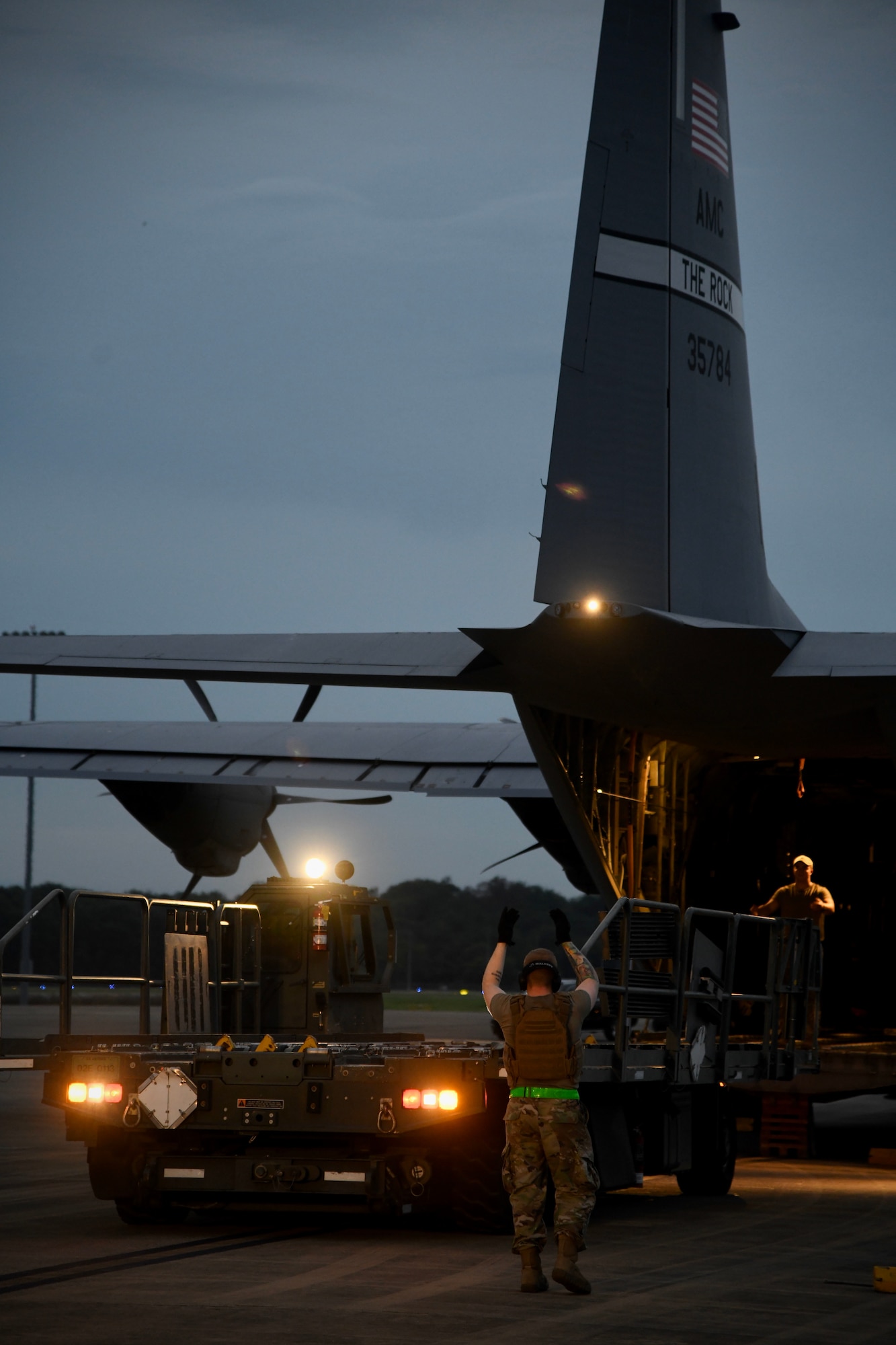 Airmen from the 821st Contingency Response Squadron load cargo onto a C-130J Super Hercules
