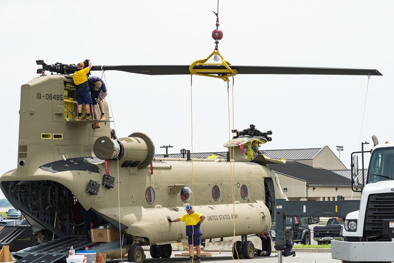 Boeing Defence Australia maintenance team members prepare a CH-47F Chinook helicopter for shipment at Dover Air Force Base, Del., June 9, 2021. BDA maintenance personnel readied two Chinooks for shipment aboard a C-5M Super Galaxy as part of the U.S. government's Foreign Military Sales program.