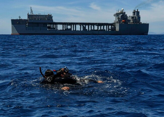 Boatswain’s Mate Seaman Jonathan Arevalo, left, and Boatswain’s Mate Seaman Jorge Loli conduct search and rescue swimmer training aboard the expeditionary sea base USS Hershel “Woody” Williams (ESB 4) in the Mediterranean Sea, May 16, 2021.