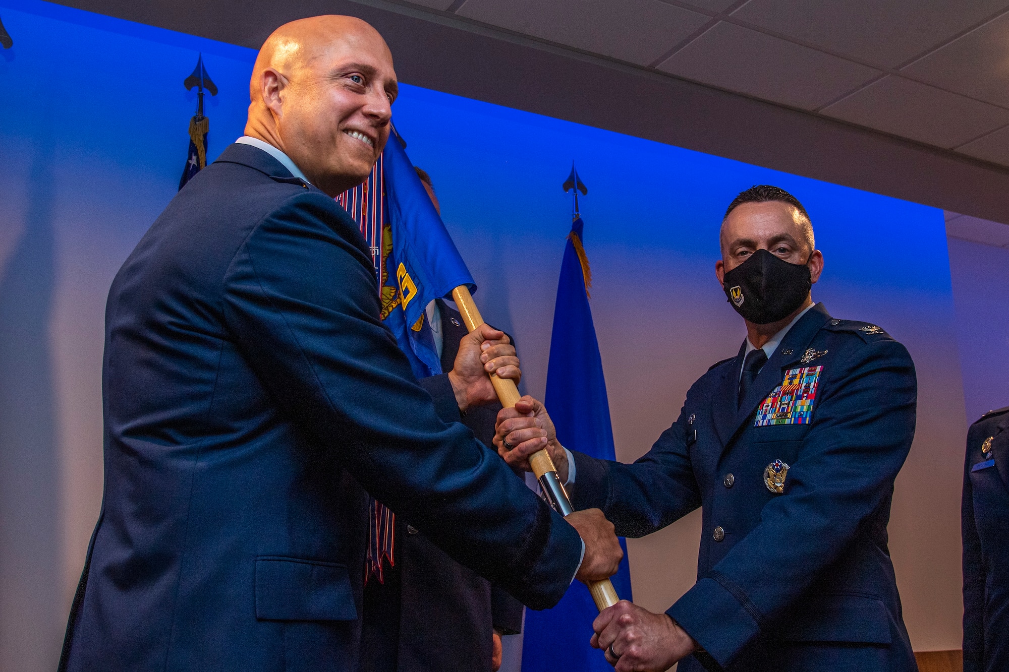 Air Force colonel holds flag