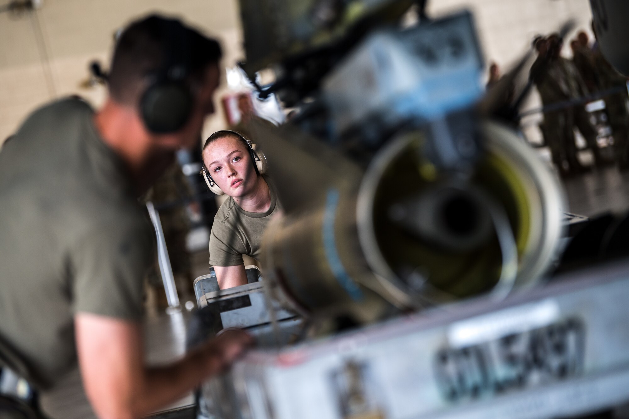 Photo of Airman working on aircraft