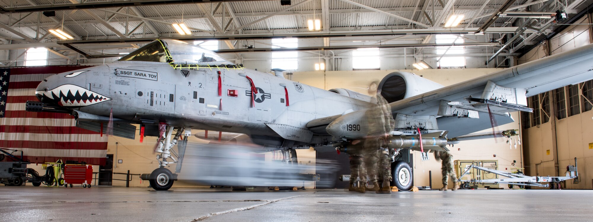 Photo of Airman working on aircraft