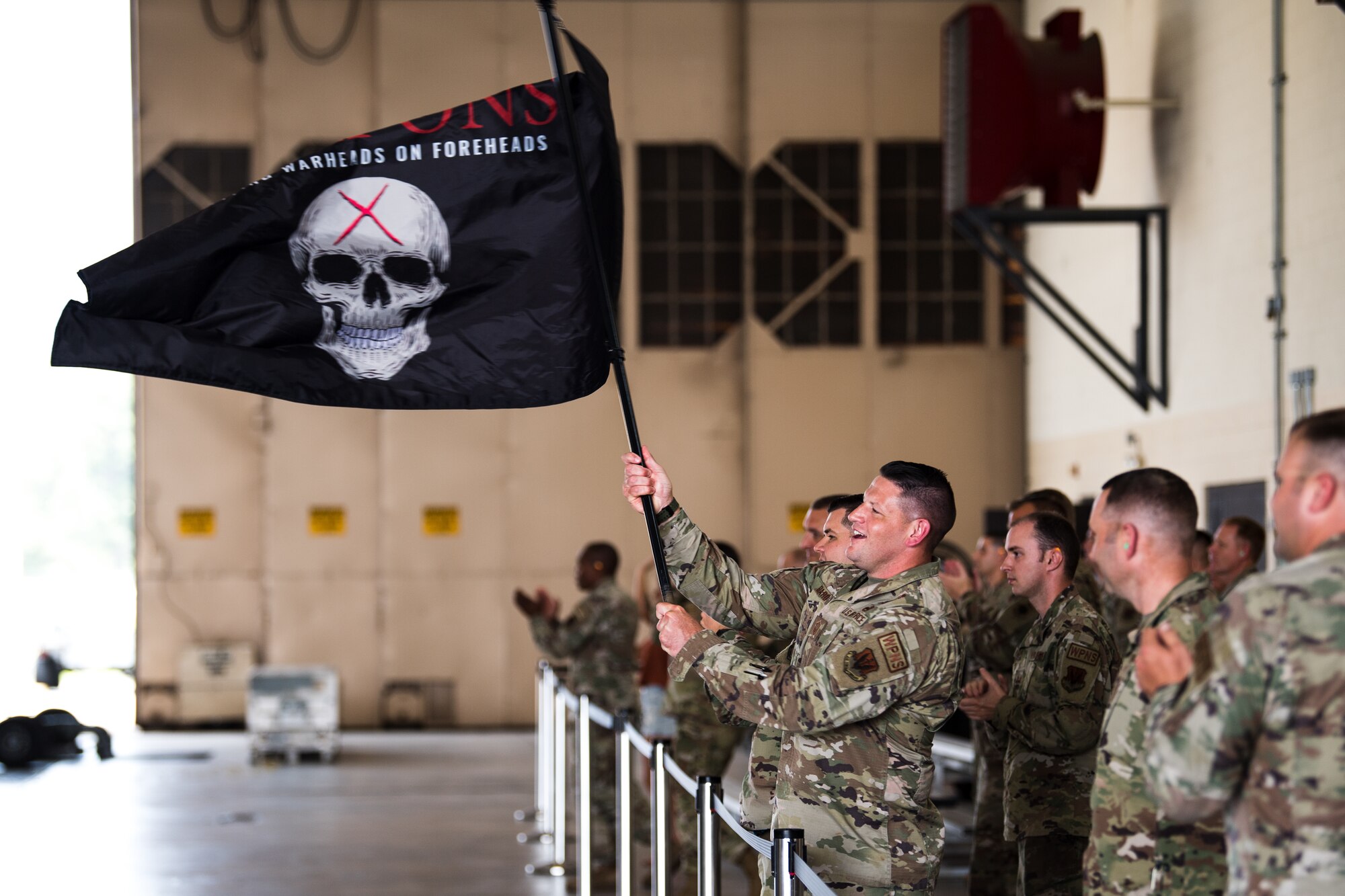 Photo of Airman waving flag