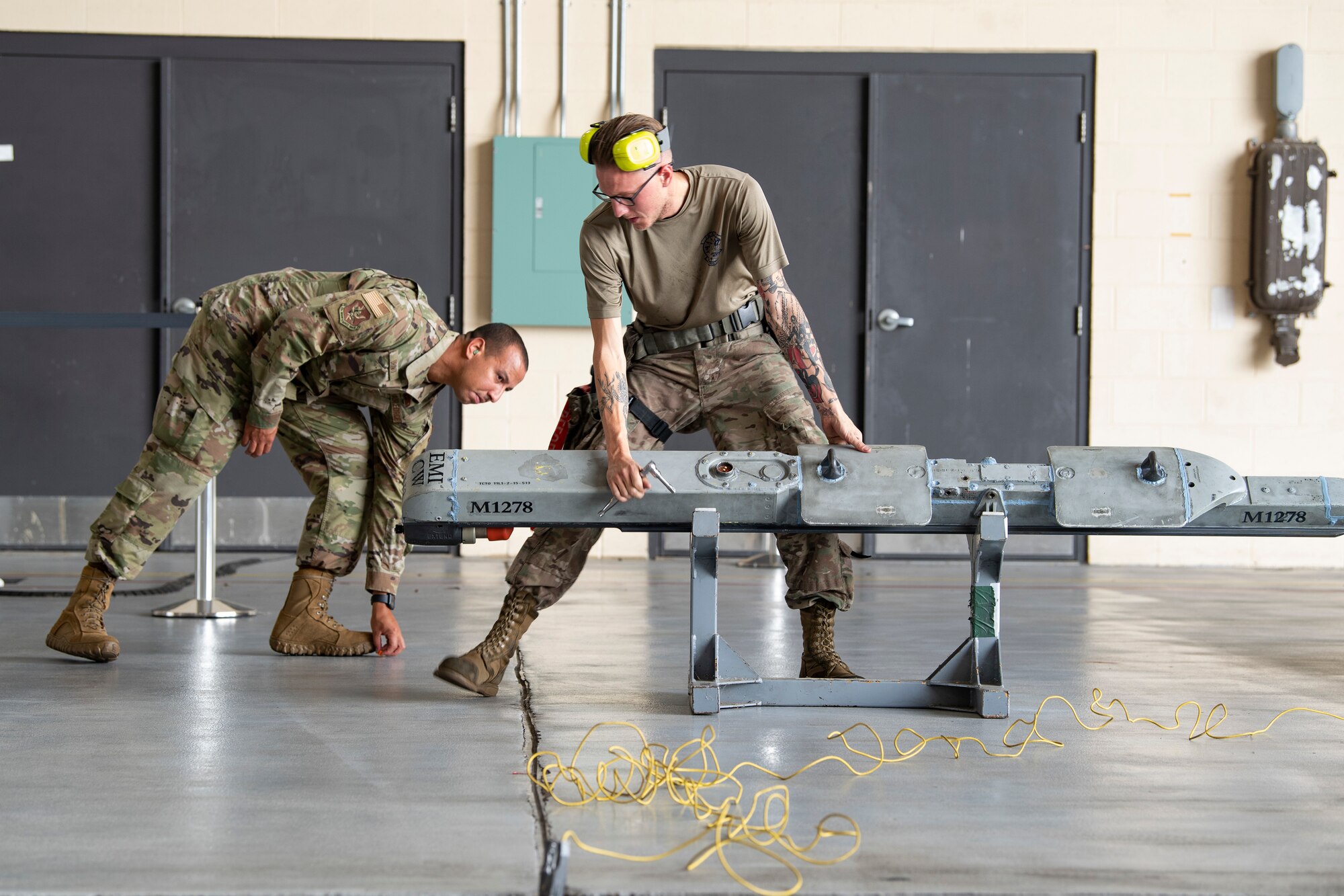 Photo of Airmen working with munitions