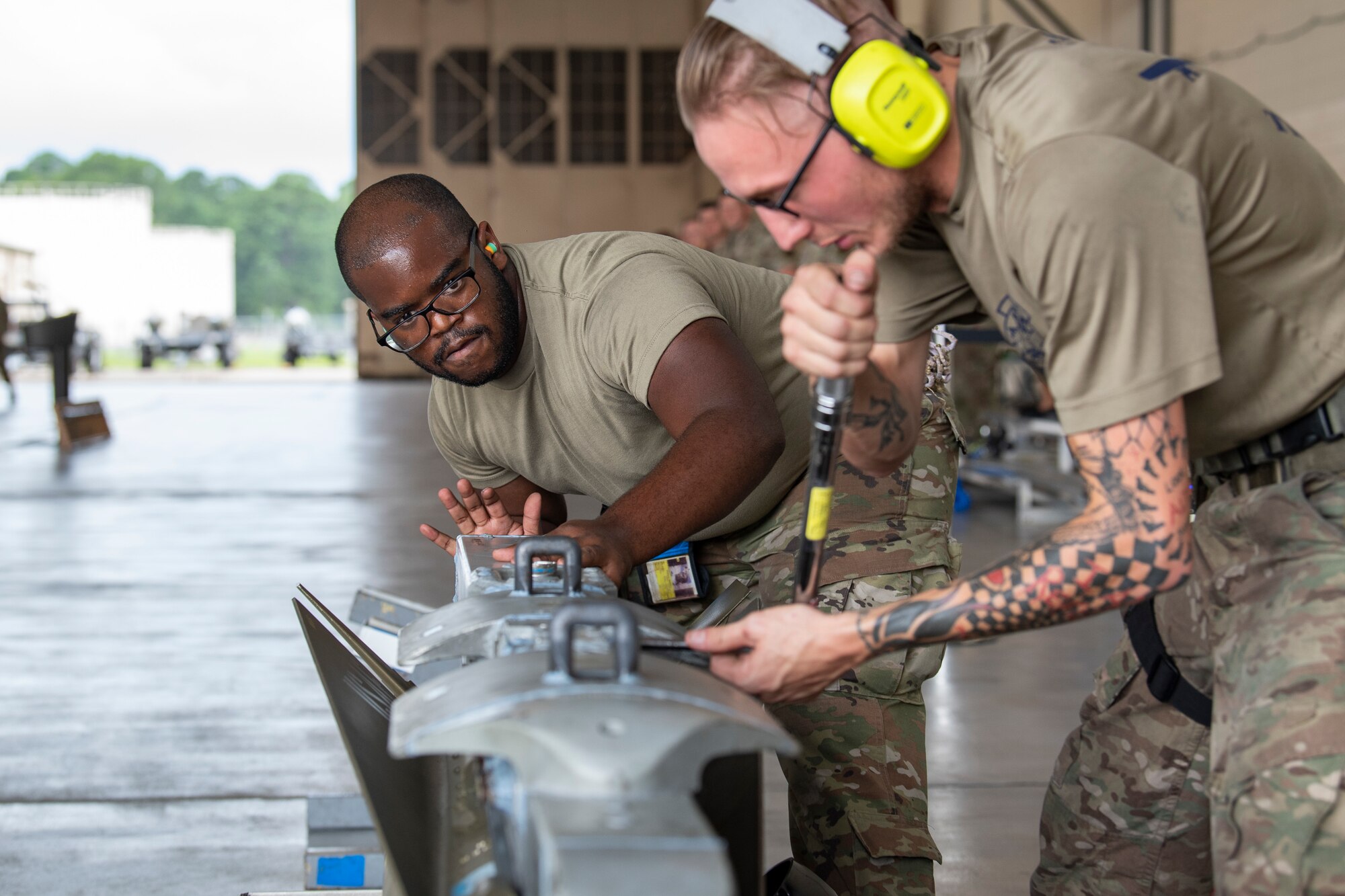 Photo of Airmen working on munitions