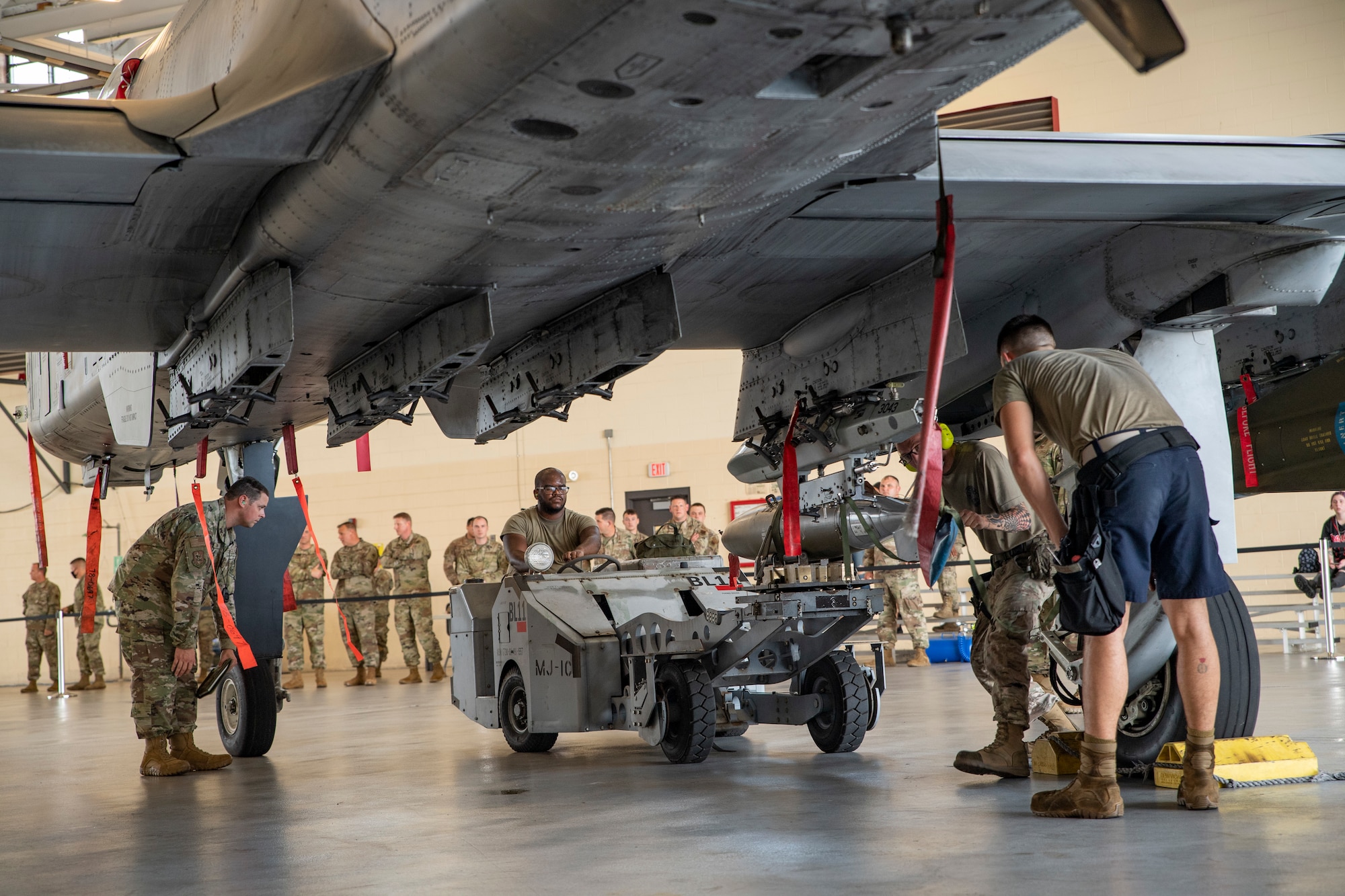 Photo of Airmen working on aircraft