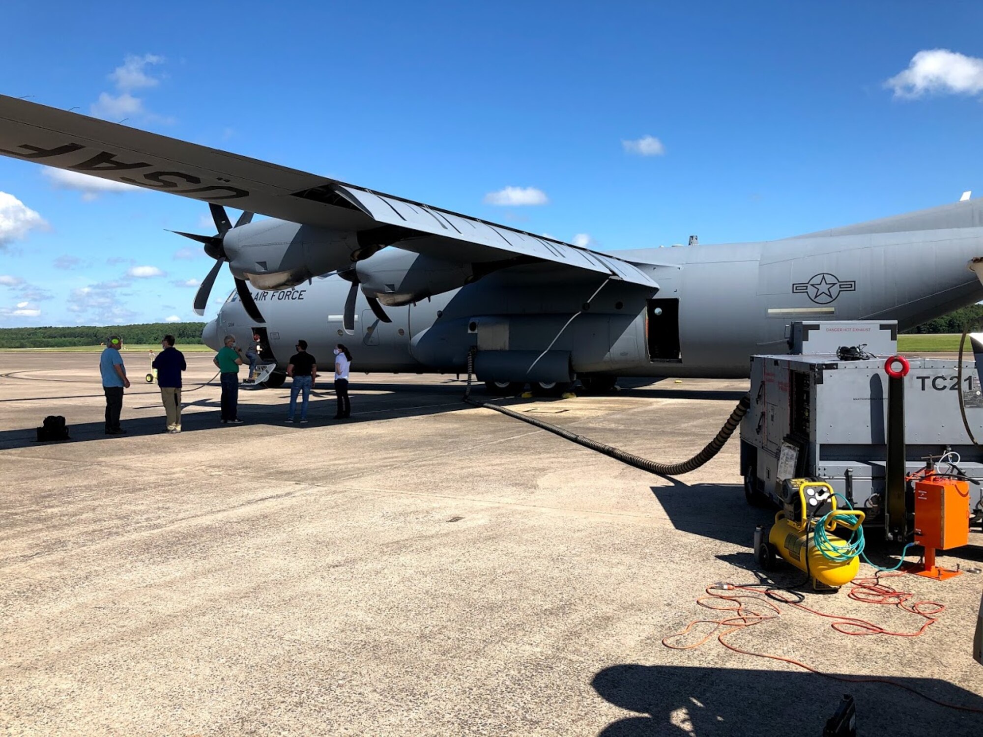 A C-130 being prepped for simulant dissemination, after which the aircraft will be  taxied and then flown to measure the rate at which the simulant leaves the aircraft. (Courtesy photo)