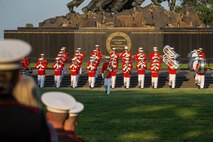Marines with “The Commandant’s Own,” U.S. Marine Drum and Bugle Corps, march onto the field during the Non-Commissioned Officer Tuesday Sunset Parade at the Marine Corps War Memorial, Arlington, Va., July 27, 2021.