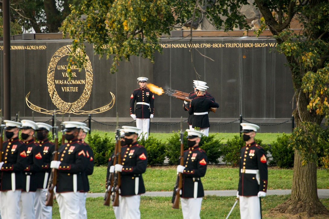 Marines with Marine Barracks Washington conduct a “three-round volley” during the Non-Commissioned Officer Tuesday Sunset Parade at the Marine Corps War Memorial, Arlington, Va., July 27, 2021. The hosting official for the evening was Sgt. Maj. Troy E. Black, Sergeant Major of the Marine Corps, and the guest of honor was Ms. Melissa Cohen, Director, Department of the Navy Sexual Assault Prevention and Response Office. (U.S. Marine Corps photo by Lance Cpl. Allen Sanders)