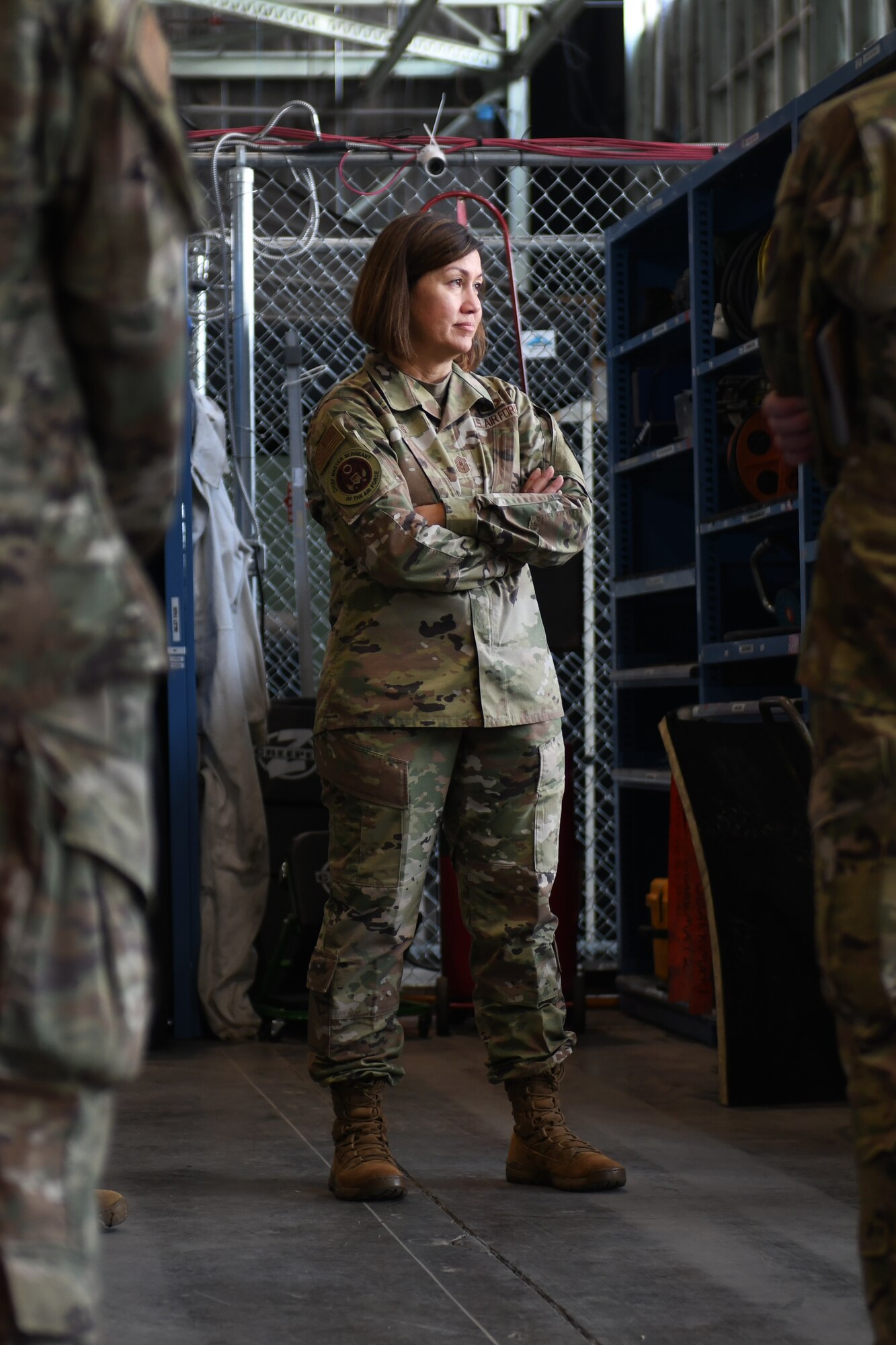 Chief Master Sergeant of the Air Force JoAnne S. Bass stands with her arms crossed.