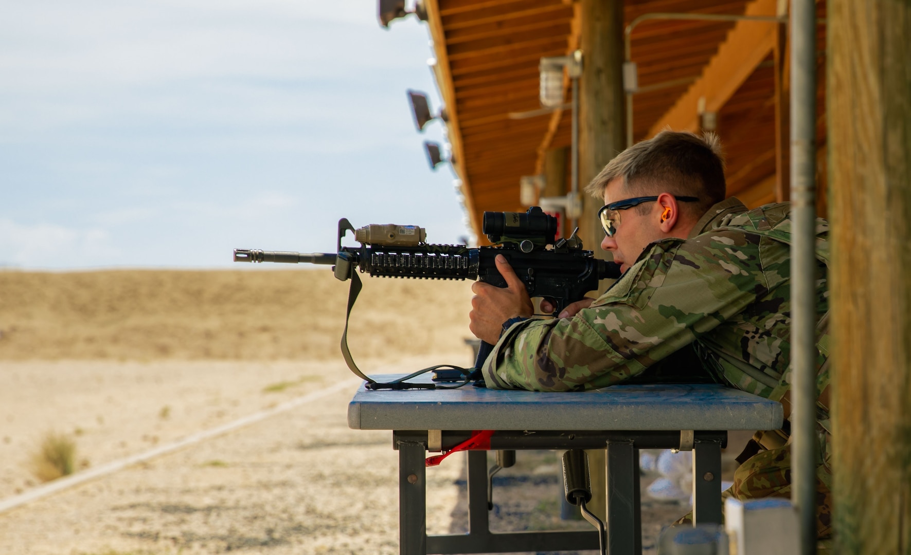 Sgt. Cole Lukens, with 208th MCAS, Tennessee Army National Guard, takes aim at his target during the Three Weapons Challenge at the 2021 Army National Guard Best Warrior Competition at Florence Training Site, Arizona, July 20, 2021. Lukens won the competition and will represent the Army Guard in the Army Best Warrior Competition in the fall.