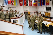 The commander of Kosovo Force (KFOR), Italian Maj. Gen. Franco Federici, welcomes the U.S. Army's 86th Infantry Brigade Combat Team (Mountain) as they assume responsibility for Regional Command East, at Camp Bondsteel, Kosovo, June 19. (U.S. Army photo by Sgt. 1st Class Jason Alvarez)