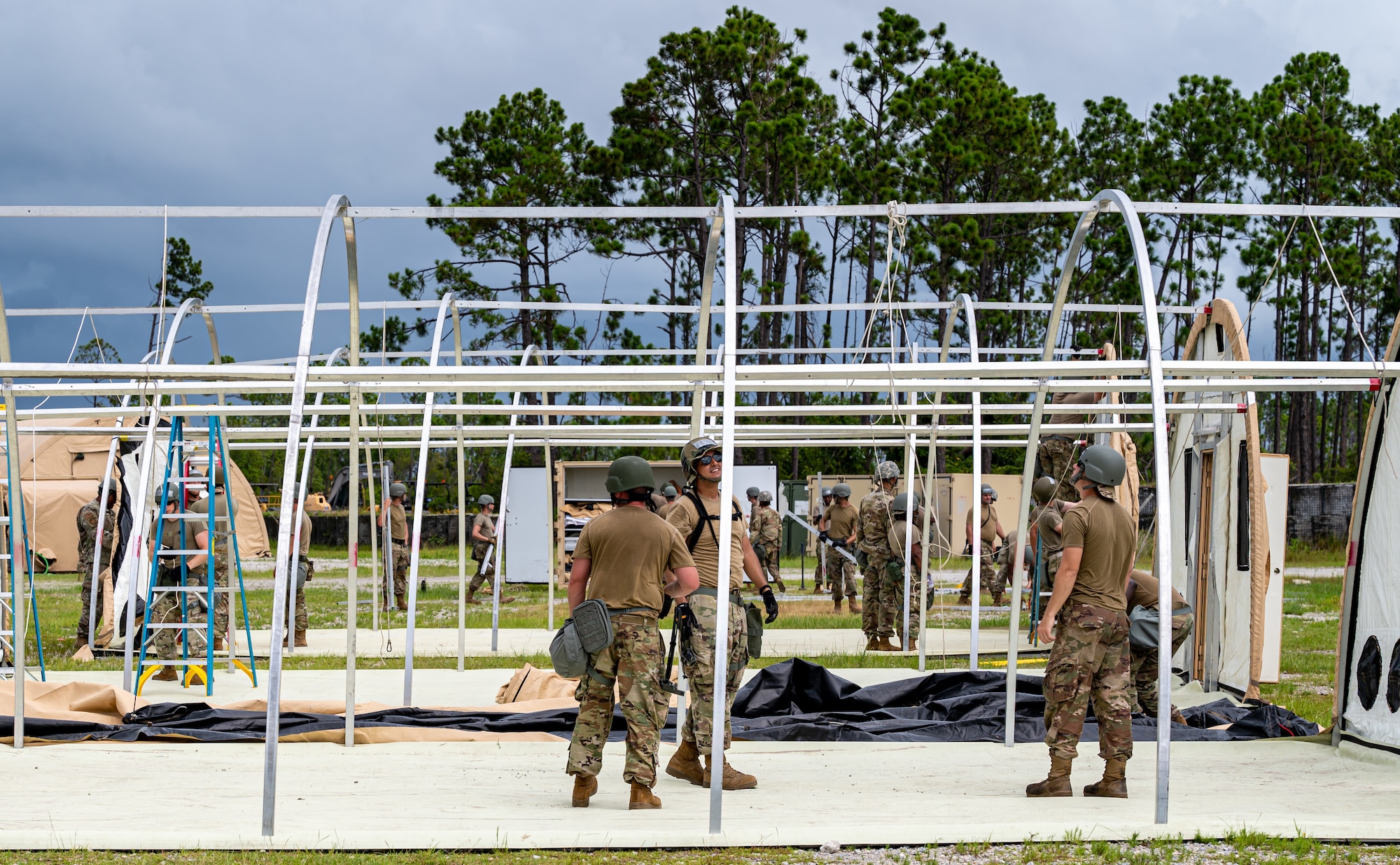 Photo of Airmen under temporary shelter