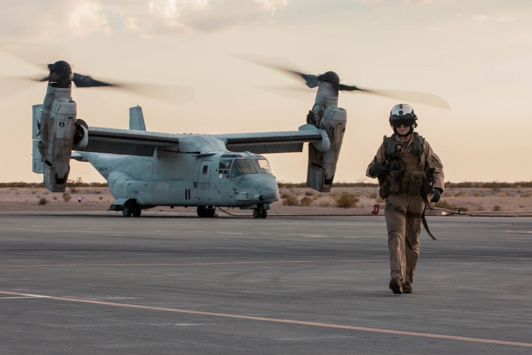 A U.S. Marine with Marine Medium Tiltrotor Squadron (VMM) 774 prepares to board Marines with Lima Company, 3rd Battalion, 25th Marines on to an MV-22 Osprey during Integrated Training Exercise (ITX) 4-21 at Marine Corps Air Ground Combat Center, Twentynine Palms, California on July 28, 2021. Marines with VMM-774 inserted Lima Company as a part of Battalion Distributed Operations Course, a sub-event of ITX that requires close coordination of air and ground assets in a geographically dispersed area of operations. (U.S Marine Corps photo by Lance Cpl. David Intriago)