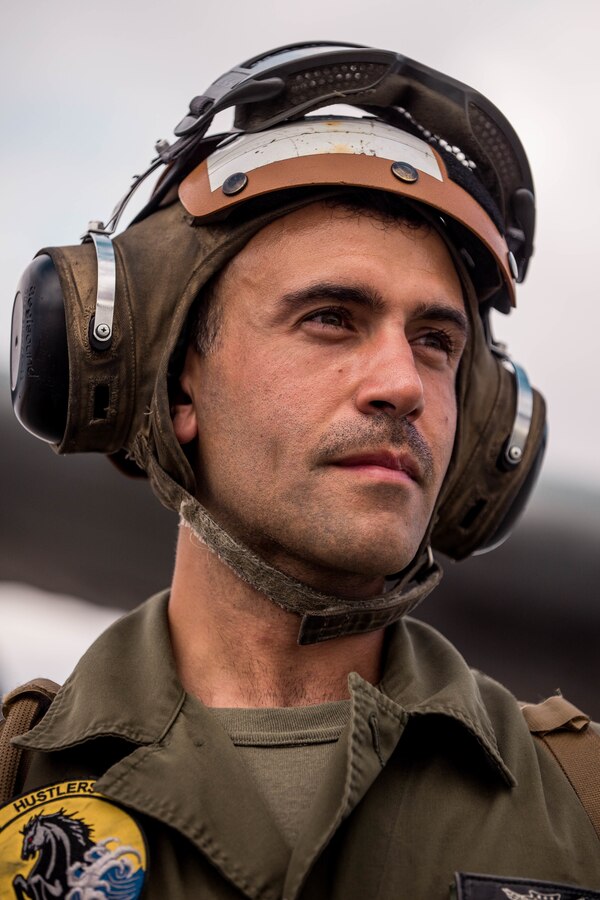 Gunnery Sgt. Derek Torrellas, an aircrew coordinator with Marine Heavy Helicopter Squad (HMH) 772 conducts pre flight maintenance on an CH-53E Super Stallion during Integrated Training Exercise (ITX) 4-21 at Marine Corps Air Ground Combat Center Twentynine Palms, California on July 28, 2021. HMH-772 is supporting Marine Air Ground Task Force 25 as part of the Aviation Combat Element during ITX, providing troop transport and heavy lift capabilities. (U.S Marine Corps photo by Lance Cpl. David Intriago)