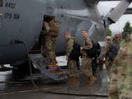 Airmen assigned to the 158th Fighter Wing, Vermont Air National Guard, board a C-130 Hercules at the Vermont Air National Guard base, South Burlington, Vt., July 13, 2021. Airmen, aircraft and support equipment from the Vermont Air National Guard depart to Nellis Air Force Base, Nev., for a three-week exercise, known as Red Flag—an exercise providing pilots, aircrew and operators a realistic training environment to prepare them for any combat environment. (U.S. Air National Guard photo by Tech. Sgt. Richard Mekkri)