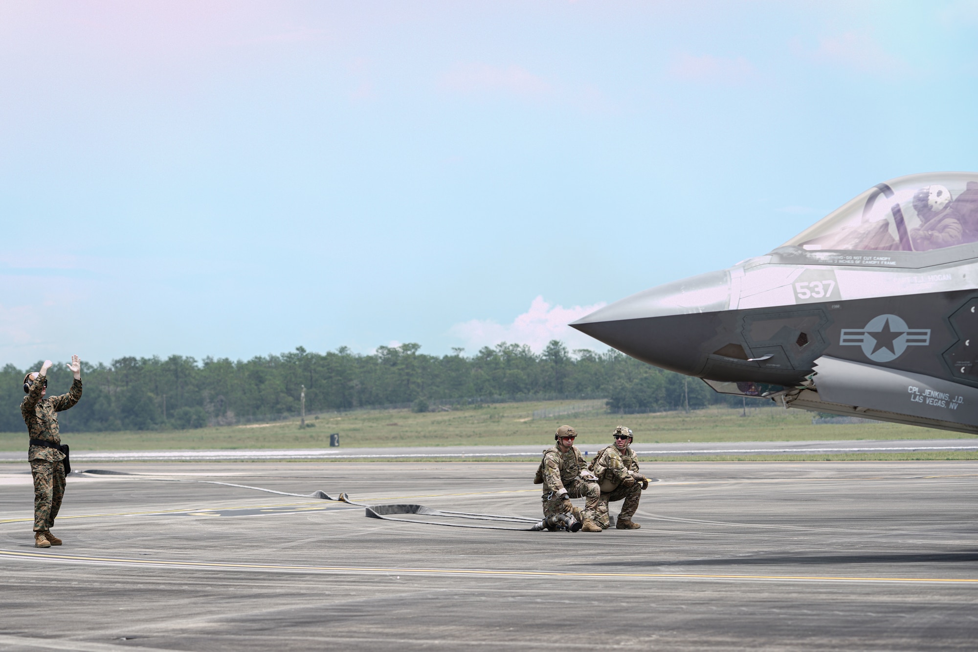 A U.S. Marine marshals in an F-35B Lightning II during a forward arming and refueling point demonstration at Duke Field, Florida, July 21, 2021.